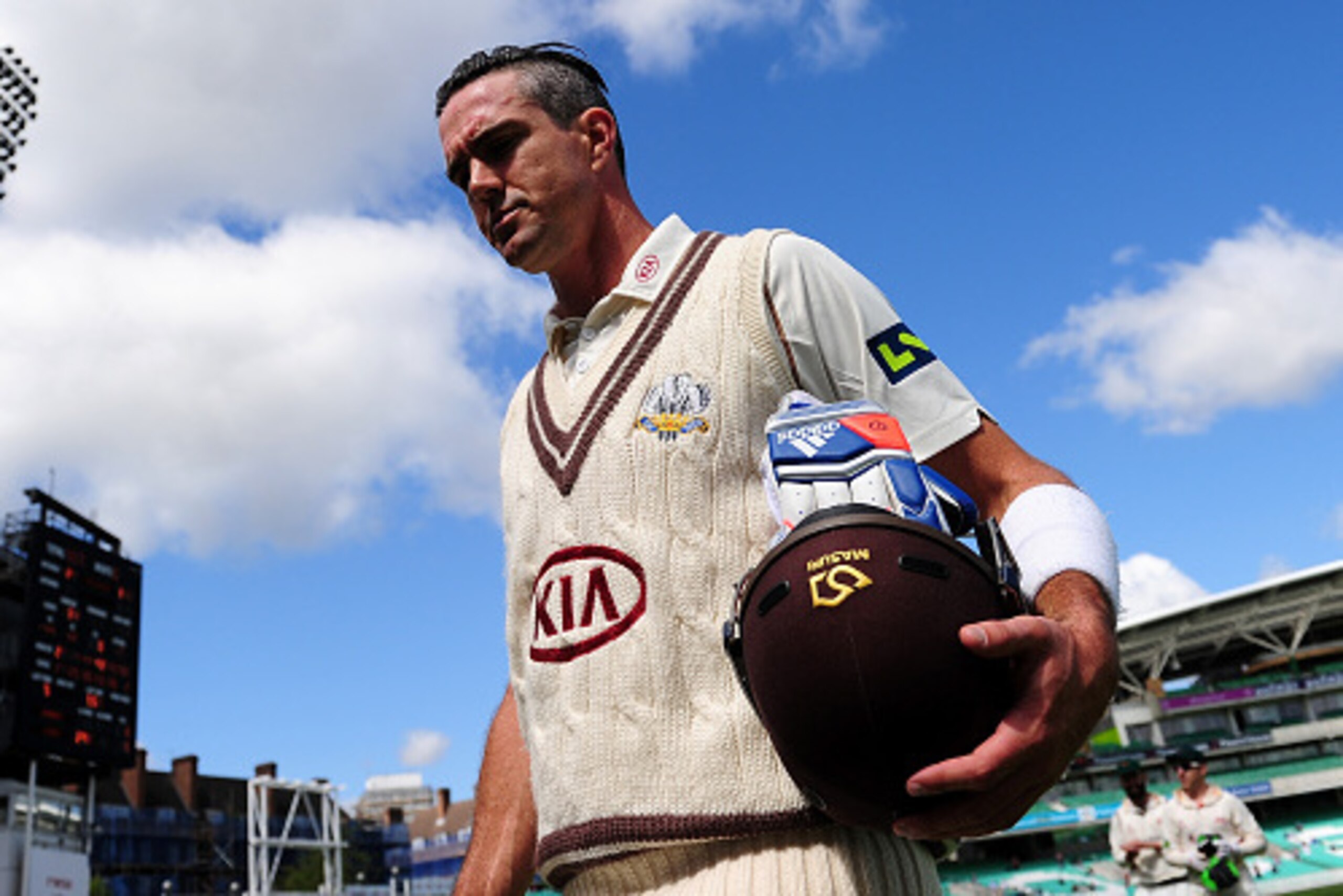 LONDON, ENGLAND - MAY 12:  Kevin Pietersen of Surrey leaves the field at the end of the Surrey innings on 355 not out during day three of the LV County Championship match between Surrey and Leicestershire at The Kia Oval on May 12, 2015 in London, England