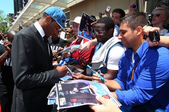 WASHINGTON - JUNE 25: Draft pick John Wall of the Washington Wizards signs autographs during a press conference at the Verizon Center on June 25, 2010 in Washington, DC. NOTE TO USER: User expressly acknowledges and agrees that, by downloading and or usin