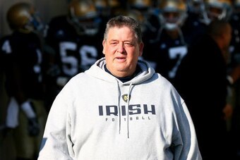 SOUTH BEND, IN - NOVEMBER 21: Head coach Charlie Weis of the Notre Dame Fighting Irish walks out of the tunnel before lining up to enter the field for a game against the Univeristy of Connecticut Huskies at Notre Dame Stadium on November 21, 2009 in South