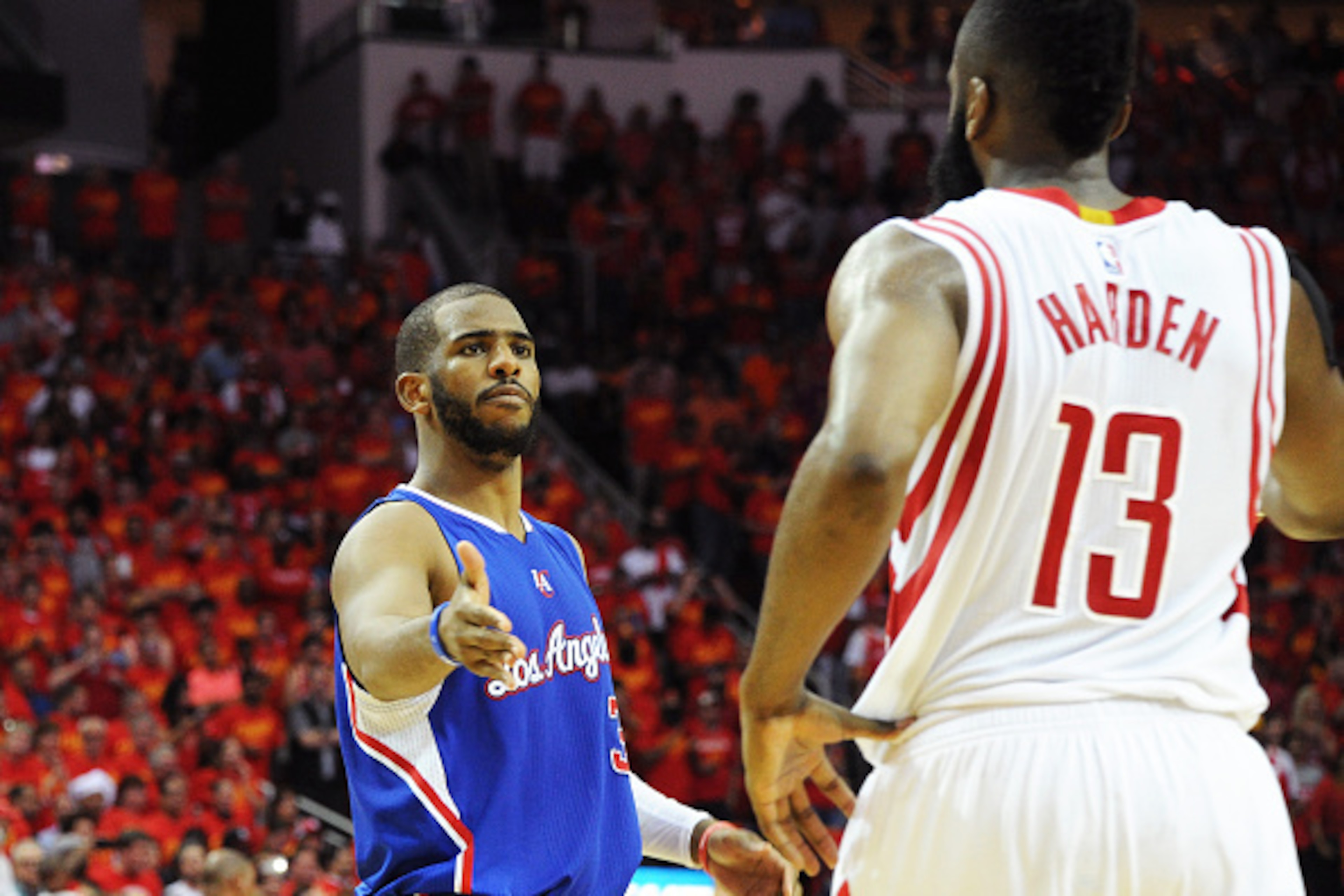HOUSTON, TX - MAY 17: Chris Paul #3 of the Los Angeles Clippers shakes hands with James Harden #13 of the Houston Rockets in Game Seven of the Western Conference Semifinals during the 2015 NBA Playoffs on May 17, 2015 at the Toyota Center in Houston, Texa