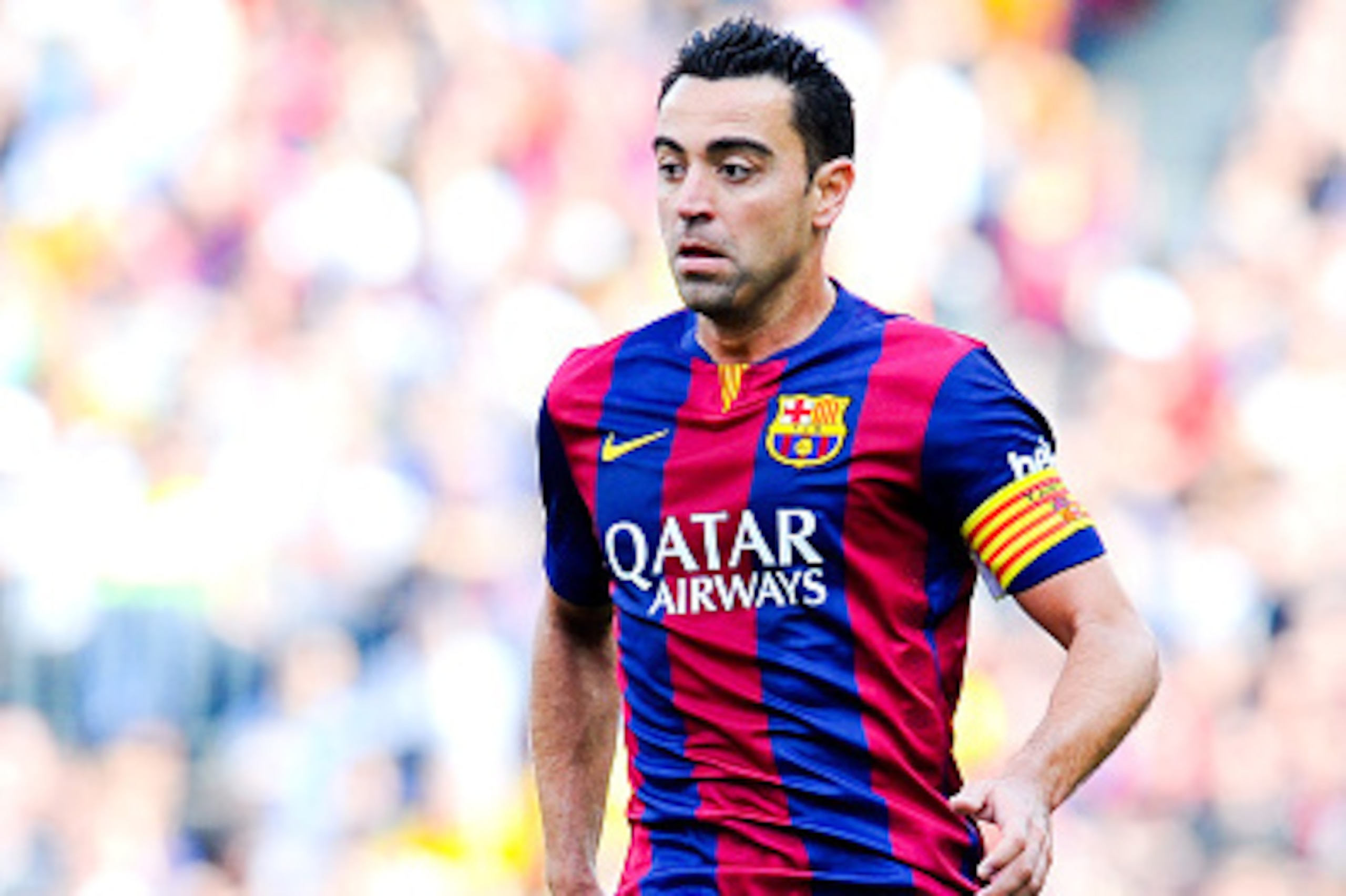BARCELONA, SPAIN - APRIL 18:  Xavi Hernandez of FC Barcelona runs with the ball during the La Liga match between FC Barcelona and Valencia CF at Camp Nou on April 18, 2015 in Barcelona, Spain.  (Photo by David Ramos/Getty Images)