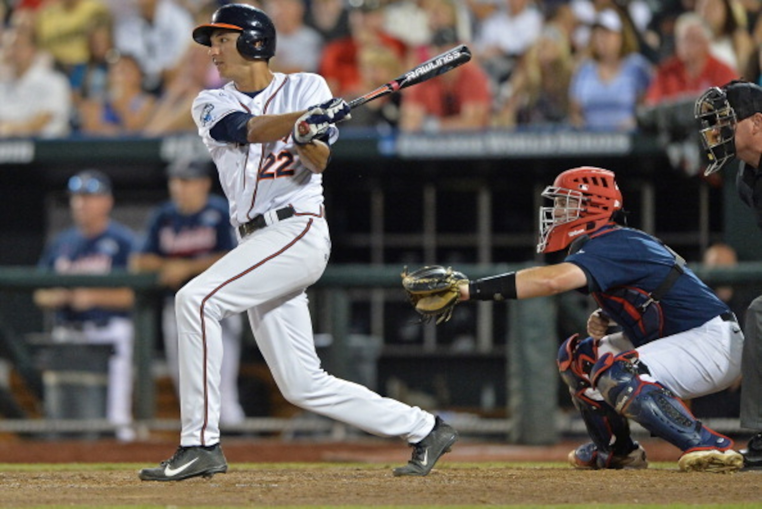 Omaha, NE - JUNE 23:  Shortstop Daniel Pinero #22 of the Virginia Cavaliers singles in a run against the Vanderbilt Commodores in the fifth inning during game one of the College World Series Championship on June 23, 2014 at TD Ameritrade Park in Omaha, Ne