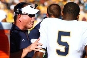 Nov 8, 2014; Tempe, AZ, USA; Notre Dame Fighting Irish head coach Brian Kelly talks to quarterback Everett Golson (5) against the Arizona State Sun Devils at Sun Devil Stadium. Arizona State defeated Notre Dame 55-31. Mandatory Credit: Mark J. Rebilas-USA