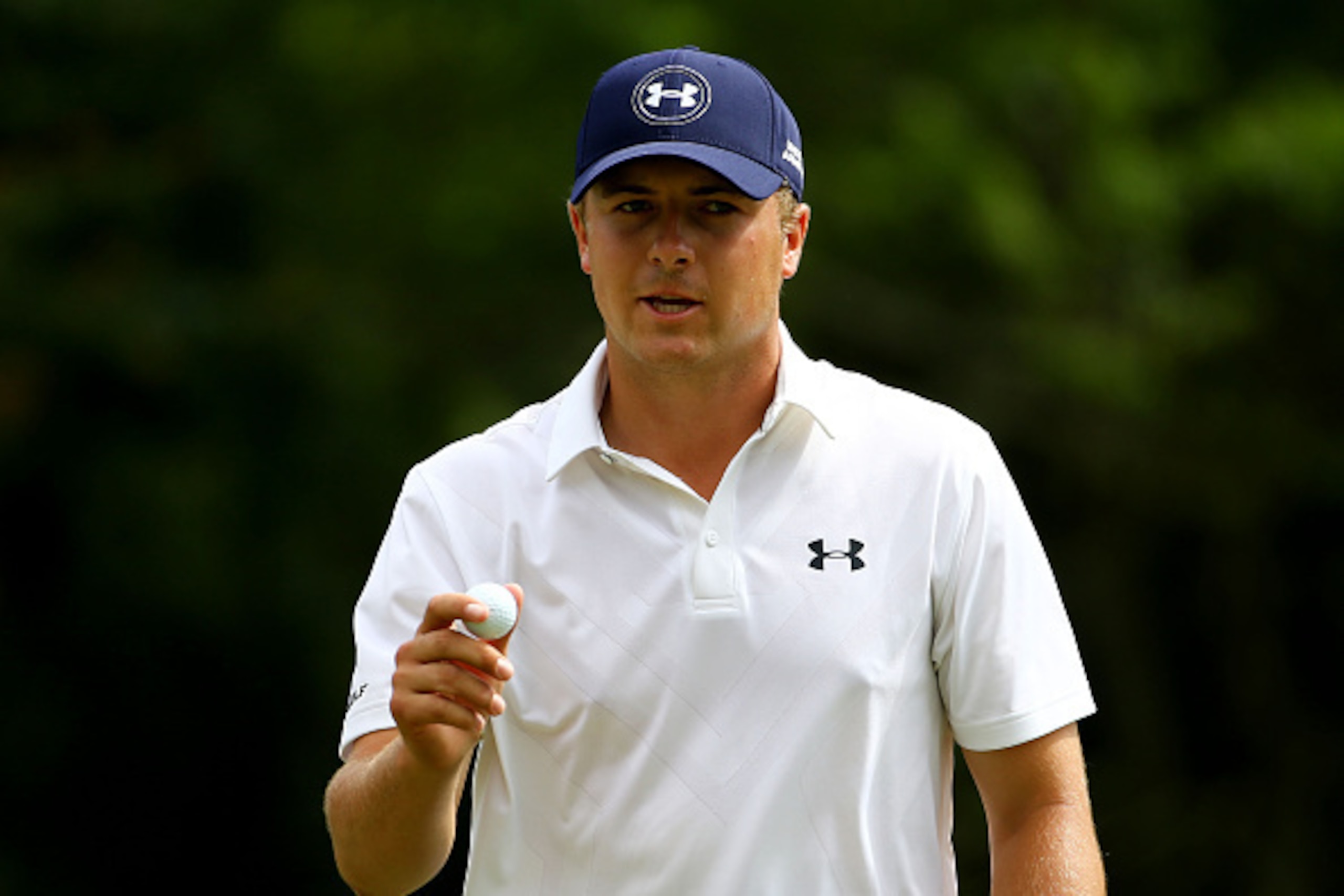 PONTE VEDRA BEACH, FL - MAY 08:  Jordan Spieth holds up his ball on the eighth green during round two of THE PLAYERS Championship at the TPC Sawgrass Stadium course on May 8, 2015 in Ponte Vedra Beach, Florida.  (Photo by Richard Heathcote/Getty Images)