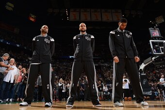 SAN ANTONIO - APRIL 24: Tony Parker #9 Manu Ginobili #20 and Tim Duncan #21 of the San Antonio Spurs before the game against the Los Angeles Clippers during Game Three of the Western Conference Quarterfinals at the AT&T Center on April 24, 2015 in San Ant