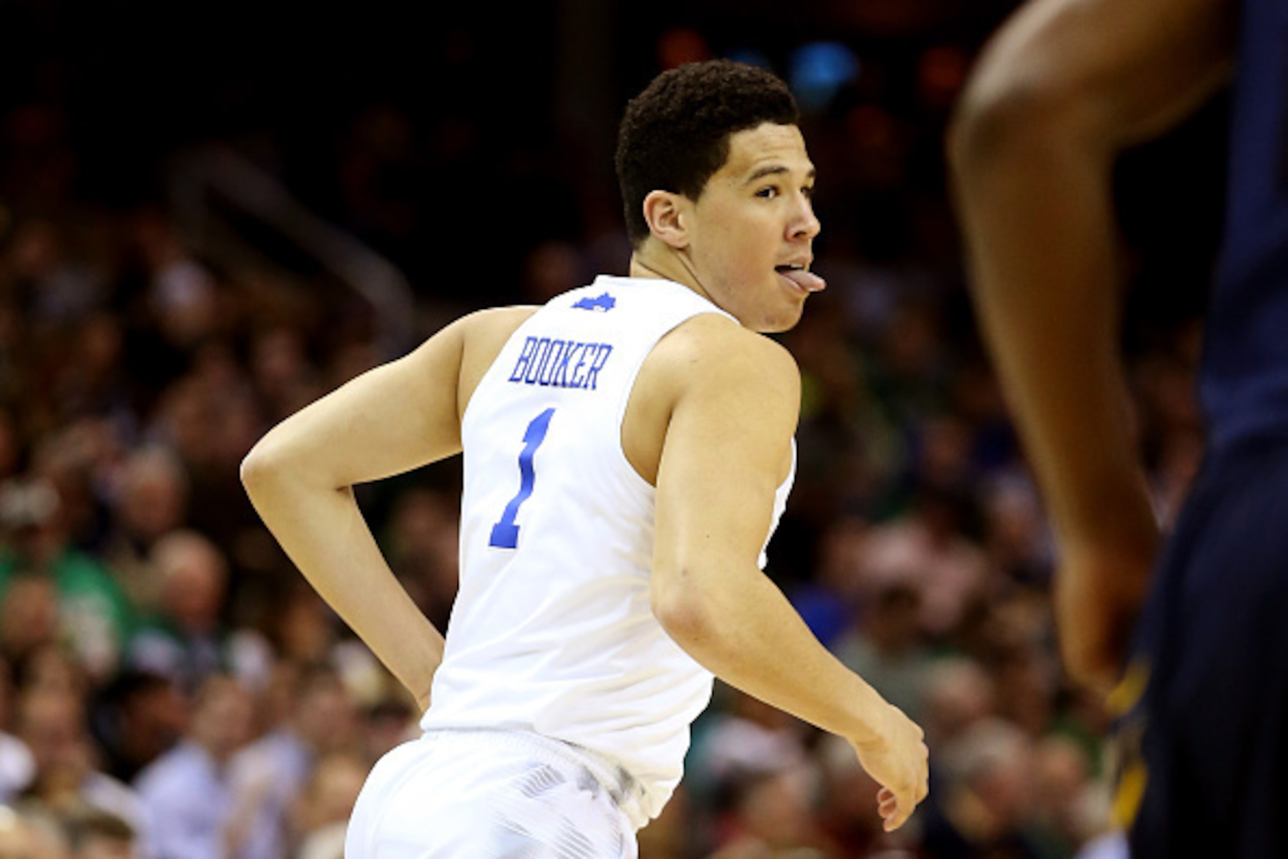 CLEVELAND, OH - MARCH 26: Devin Booker #1 of the Kentucky Wildcats reacts after making a three point basket in the first half against the West Virginia Mountaineers during the Midwest Regional semifinal of the 2015 NCAA Men's Basketball Tournament at Quic