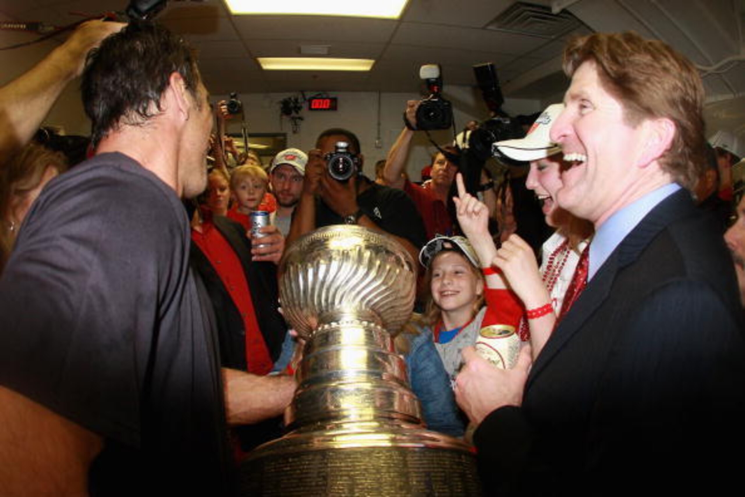 PITTSBURGH - JUNE 04:  Chris Chelios and head coach Mike Babcock of the Detroit Red Wings celebrate with the Stanley Cup in the locker room after defeating the Pittsburgh Penguins in game six of the 2008 NHL Stanley Cup Finals at Mellon Arena on June 4, 2
