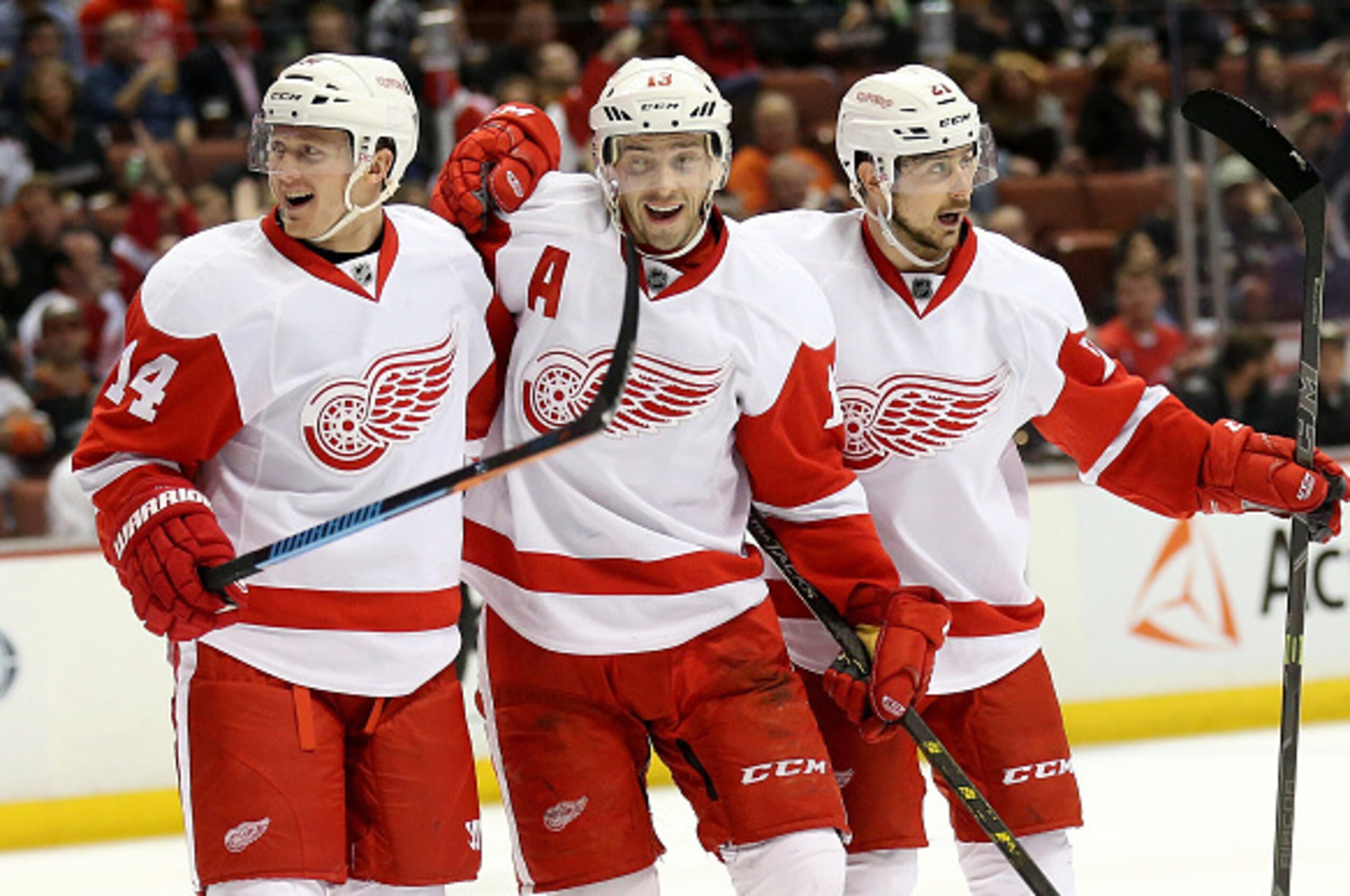 ANAHEIM, CA - FEBRUARY 23:  Pavel Datsyuk #13 (C) of the Detroit Red Wings celebrates with Gustav Nyquist #14 and Tomas Tatar #21 after scoring on a power play for his second goal of the second period against the Anaheim Ducks at Honda Center on February 