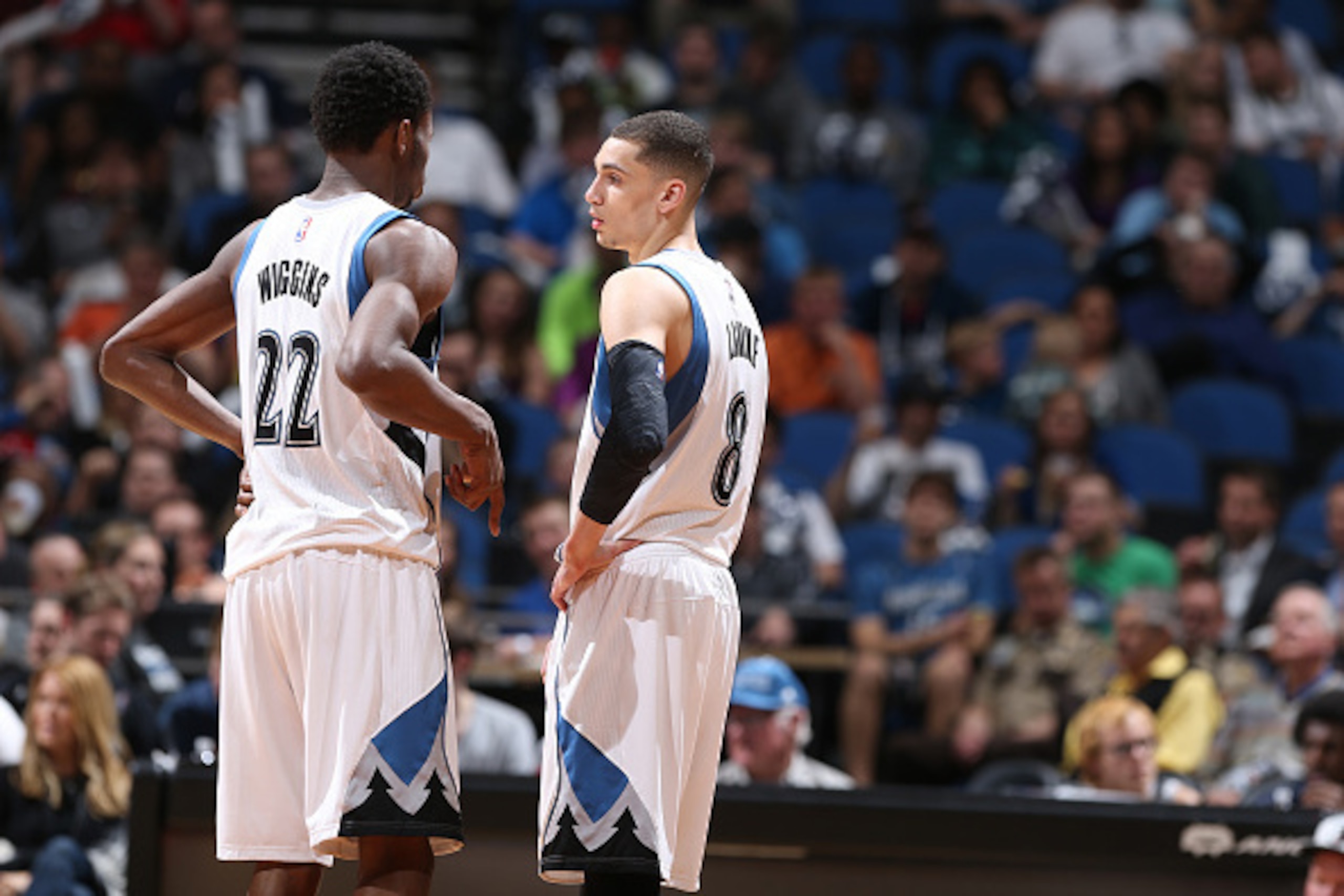 MINNEAPOLIS, MN - APRIL 13: Andrew Wiggins #22 and Zach LaVine #8 of the Minnesota Timberwolves speak during a game against the New Orleans Pelicans during the game on April 13, 2015 at Target Center in Minneapolis, Minnesota. NOTE TO USER: User expressly