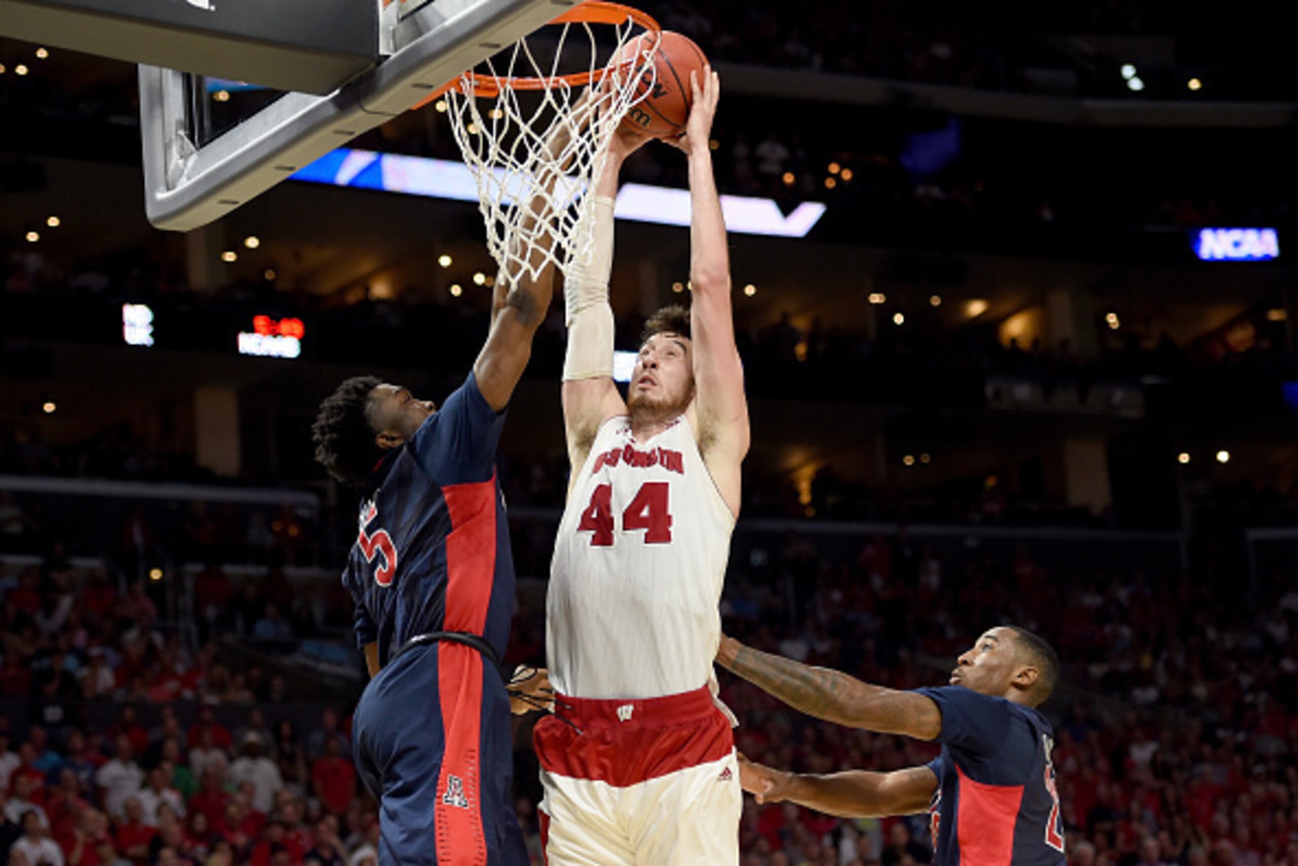LOS ANGELES, CA - MARCH 28: Frank Kaminsky #44 of the Wisconsin Badgers goes up for a dunk against Stanley Johnson #5 of the Arizona Wildcats in the second half during the West Regional Final of the 2015 NCAA Men's Basketball Tournament at Staples Center LOS ANGELES, CA - MARCH 28: Frank Kaminsky #44 of the Wisconsin Badgers goes up for a dunk against Stanley Johnson #5 of the Arizona Wildcats in the second half during the West Regional Final of the 2015 NCAA Men's Basketball Tournament at Staples Center