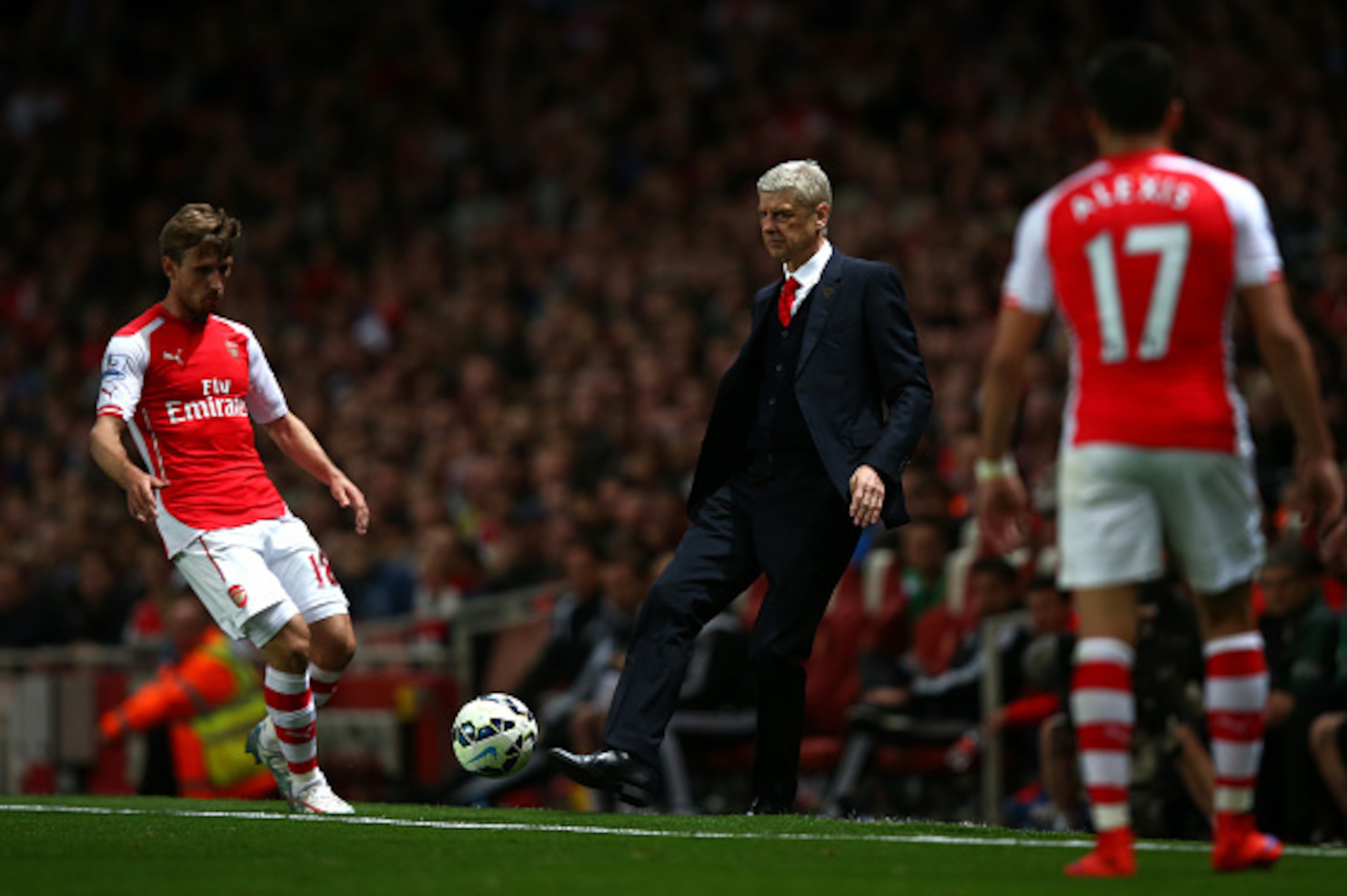 LONDON, ENGLAND - MAY 11:  Arsene Wenger, manager of Arsenal plays the ball back onto the field during the Barclays Premier League match between Arsenal and Swansea City at Emirates Stadium on May 11, 2015 in London, England.  (Photo by Clive Rose/Getty I