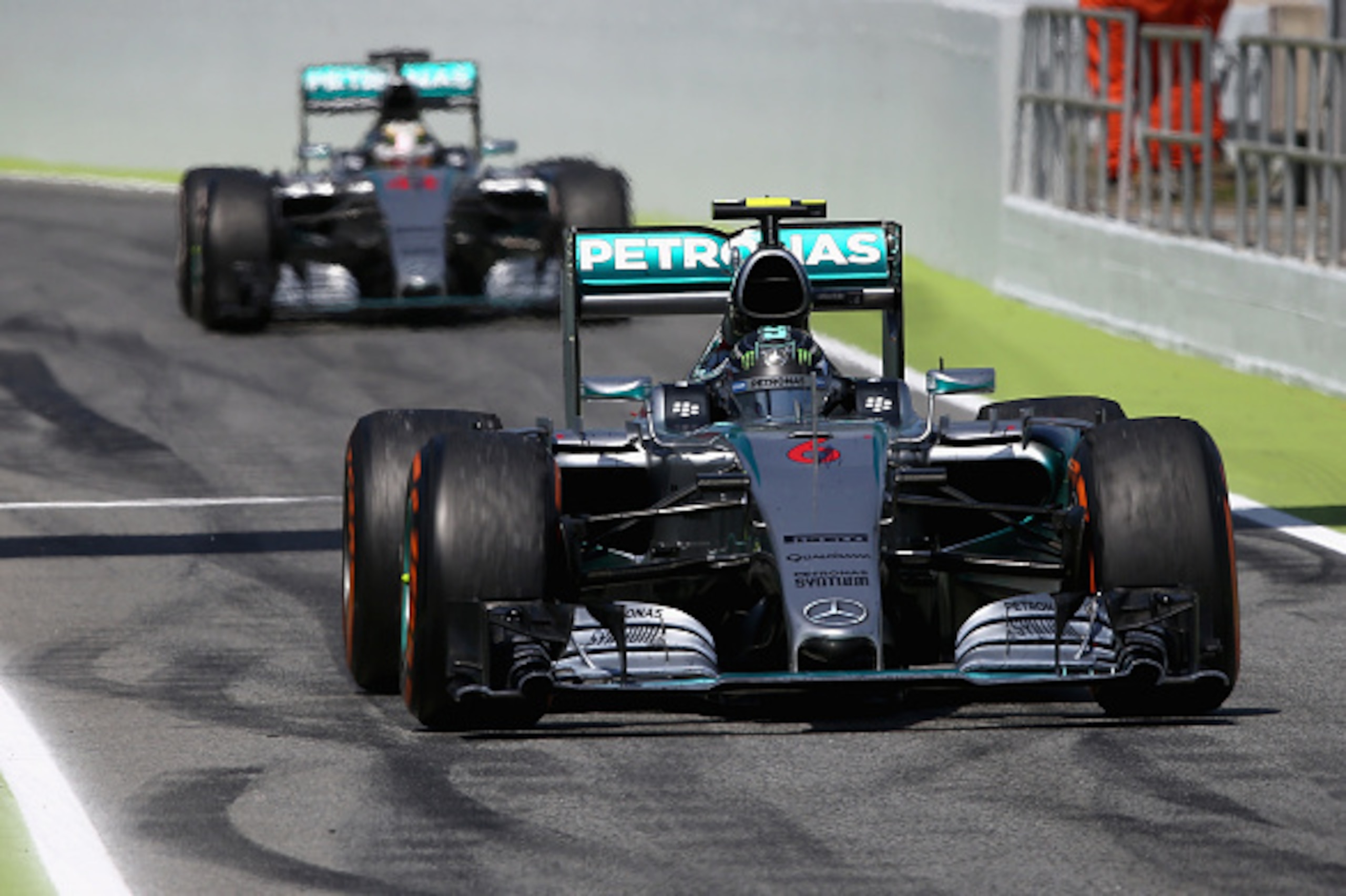 MONTMELO, SPAIN - MAY 10:  Nico Rosberg of Germany and Mercedes GP drives into Parc Ferme ahead of Lewis Hamilton of Great Britain and Mercedes GP during the Spanish Formula One Grand Prix at Circuit de Catalunya on May 10, 2015 in Montmelo, Spain.  (Phot