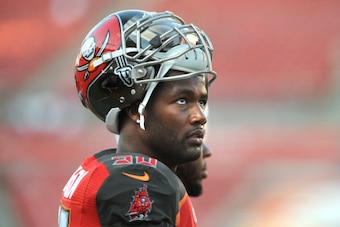 TAMPA, FL - AUGUST 28: Defensive end Michael Johnson #90 of the Tampa Bay Buccaneers before their preseason game with the Washington Redskins at Raymond James Stadium on August 28, 2014 in Tampa, Florida. (Photo by Cliff McBride/Getty Images)