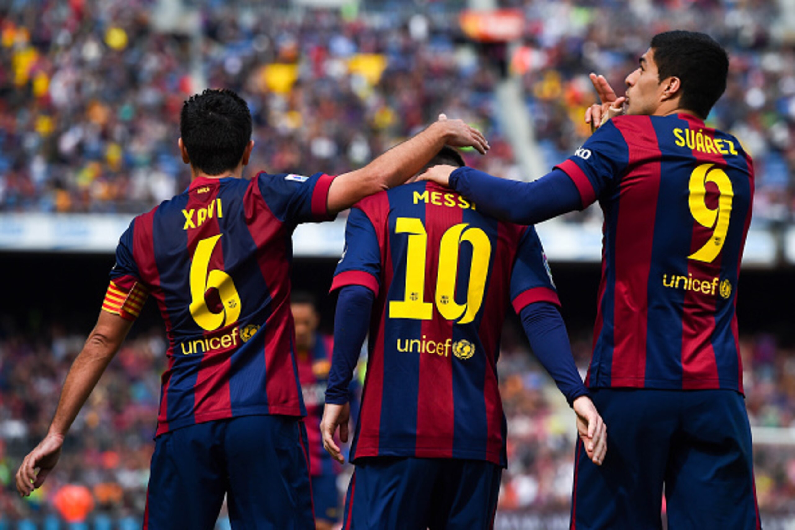 BARCELONA, SPAIN - MARCH 08: Luis Suarez of FC Barcelona (R) celebrates with his teammates Lionel Messi (C) and Xavi Hernandez of FC Barcelona after scoring his team's sixth goal during the La Liga match between FC Barcelona and Rayo Vallecano de Madrid BARCELONA, SPAIN - MARCH 08: Luis Suarez of FC Barcelona (R) celebrates with his teammates Lionel Messi (C) and Xavi Hernandez of FC Barcelona after scoring his team's sixth goal during the La Liga match between FC Barcelona and Rayo Vallecano de Madrid