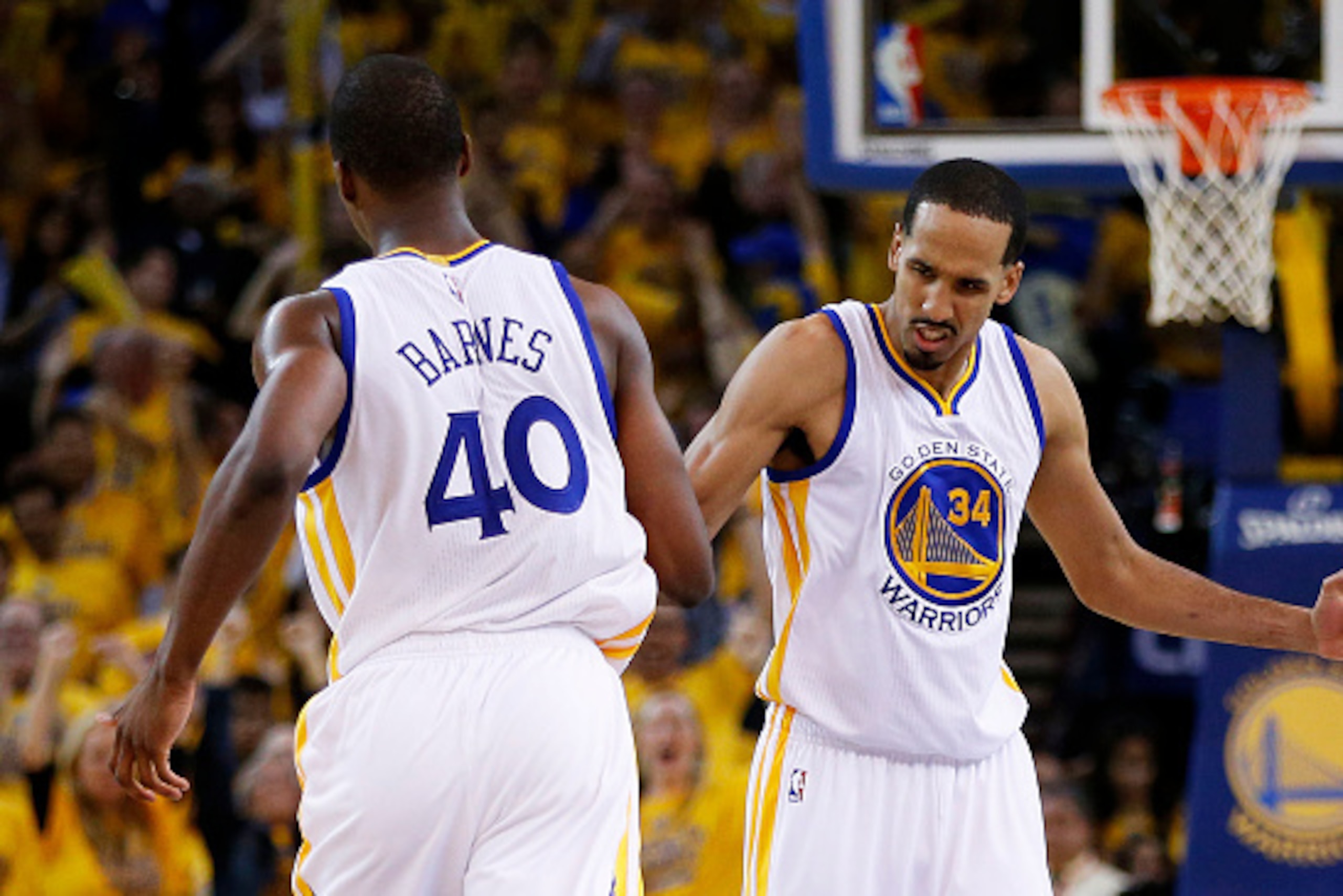 OAKLAND, CA - MAY 19:  Harrison Barnes #40 and Shaun Livingston #34 of the Golden State Warriors celebrate in the fourth quarter against the Houston Rockets during Game One of the Western Conference Finals of the 2015 NBA Playoffs at ORACLE Arena on May 1