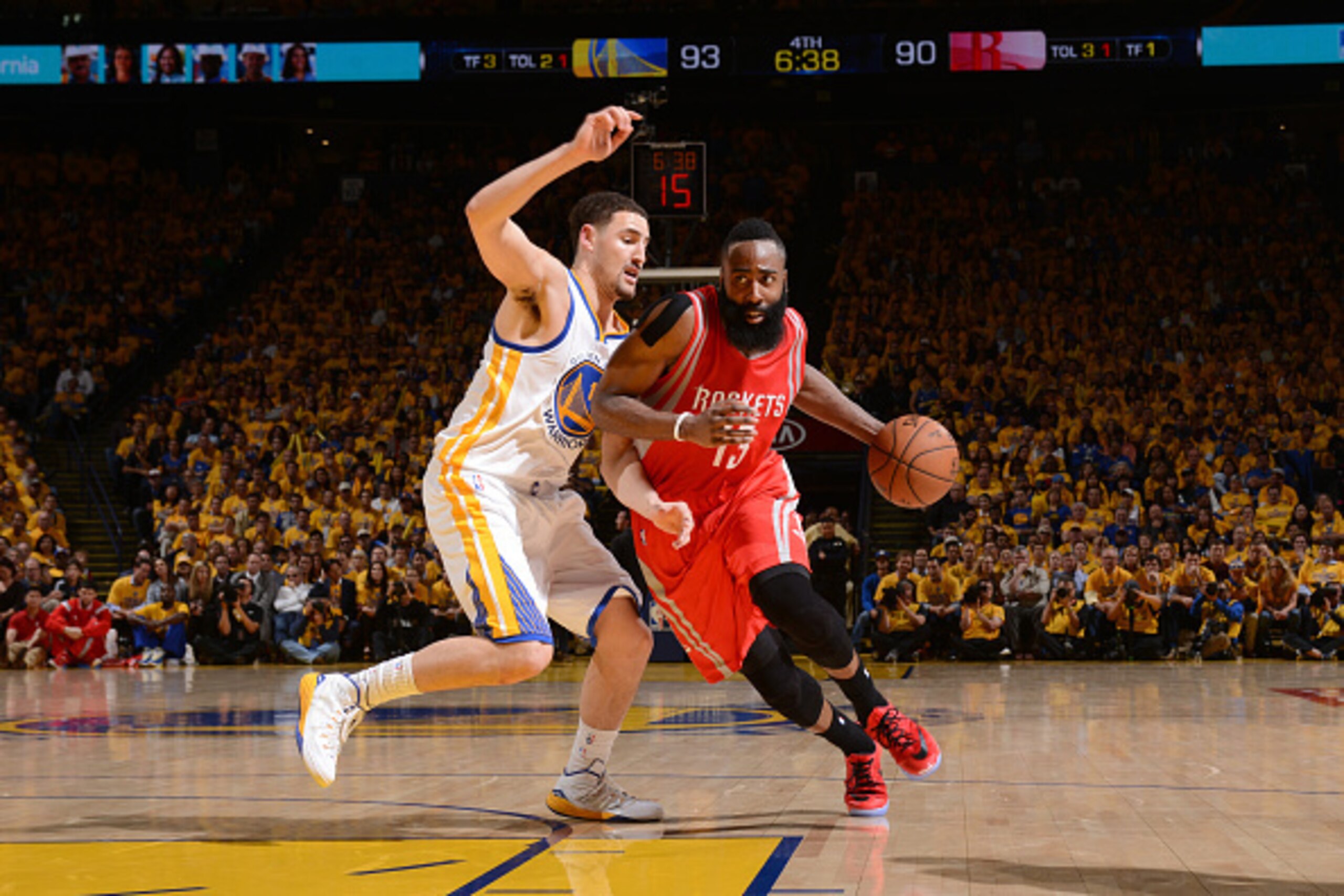 OAKLAND, CA - MAY 19: James Harden #13 of the Houston Rockets drives to the basket against Klay Thompson #11 of the Golden State Warriors during Game One of the Western Conference Finals during the NBA Playoffs on May 19, 2015 at ORACLE Arena in Oakland, 