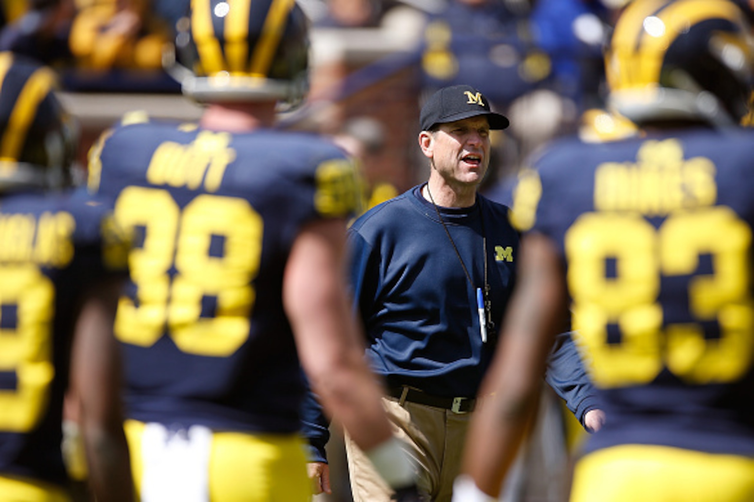 ANN ARBOR, MI - APRIL 04: Head coach Jim Harbaugh of the Michigan Wolverines looks on during the Michigan Football Spring Game on April 4, 2015 at Michigan Stadium in Ann Arbor, Michigan. (Photo by Gregory Shamus/Getty Images) ANN ARBOR, MI - APRIL 04: Head coach Jim Harbaugh of the Michigan Wolverines looks on during the Michigan Football Spring Game on April 4, 2015 at Michigan Stadium in Ann Arbor, Michigan. (Photo by Gregory Shamus/Getty Images)