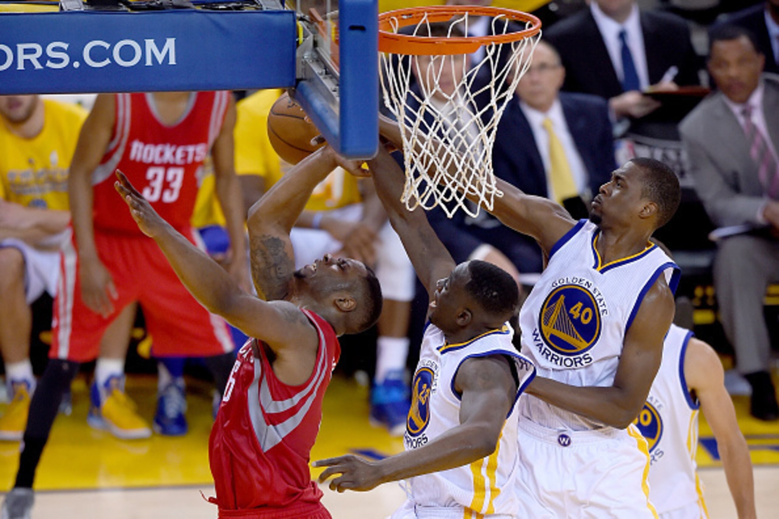 OAKLAND, CA - MAY 19:  Draymond Green #23 and Harrison Barnes #40 of the Golden State Warriors blocks the shot of Terrence Jones #6 of the Houston Rockets during the second half in Game One of the Western Conference Finals of the NBA Playoffs at ORACLE Ar
