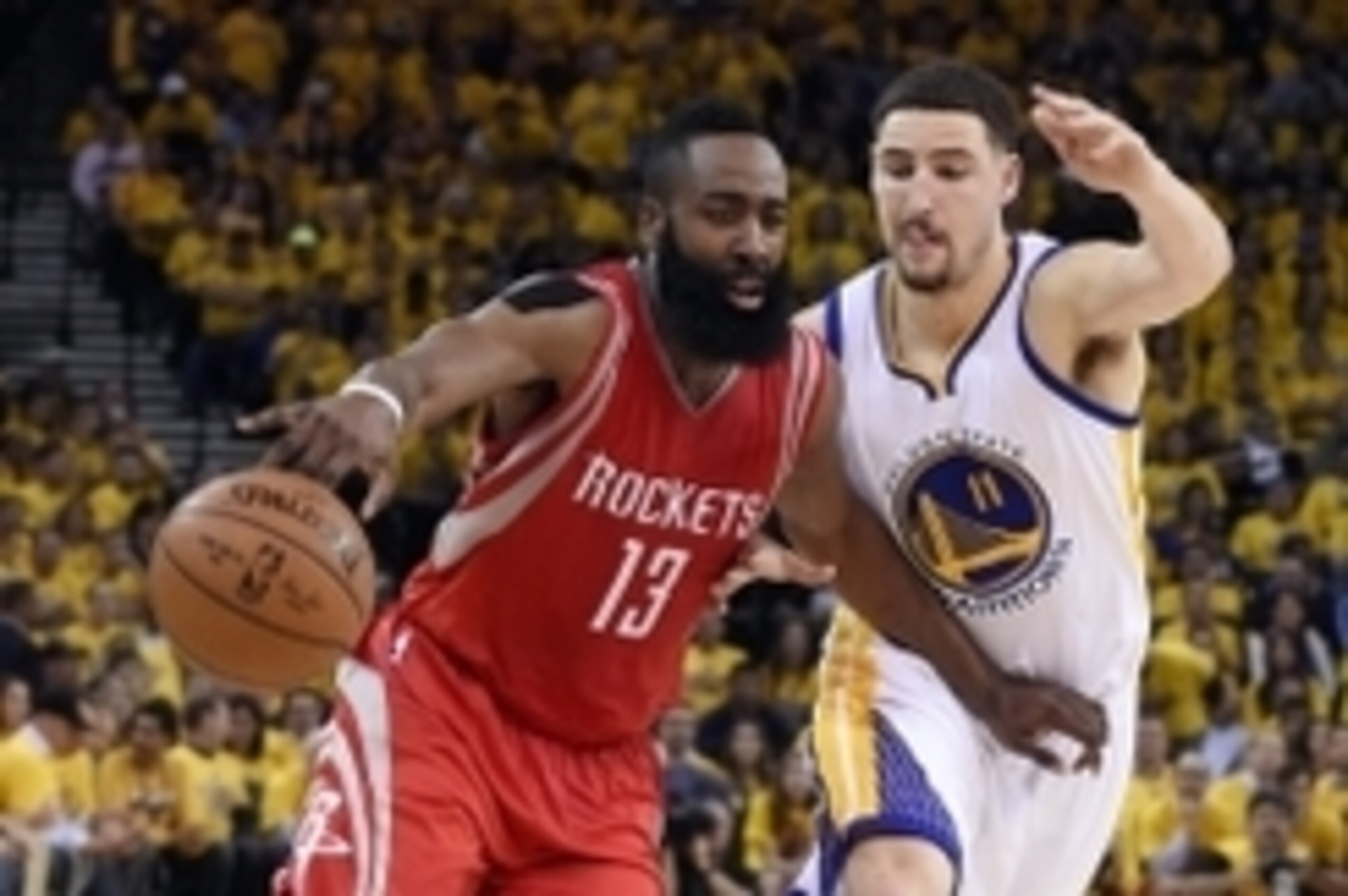 May 19, 2015; Oakland, CA, USA; Houston Rockets guard James Harden (13) drives against Golden State Warriors guard Klay Thompson (11) in the first half in game one of the Western Conference Finals of the NBA Playoffs at Oracle Arena. Mandatory Credit: Kyl