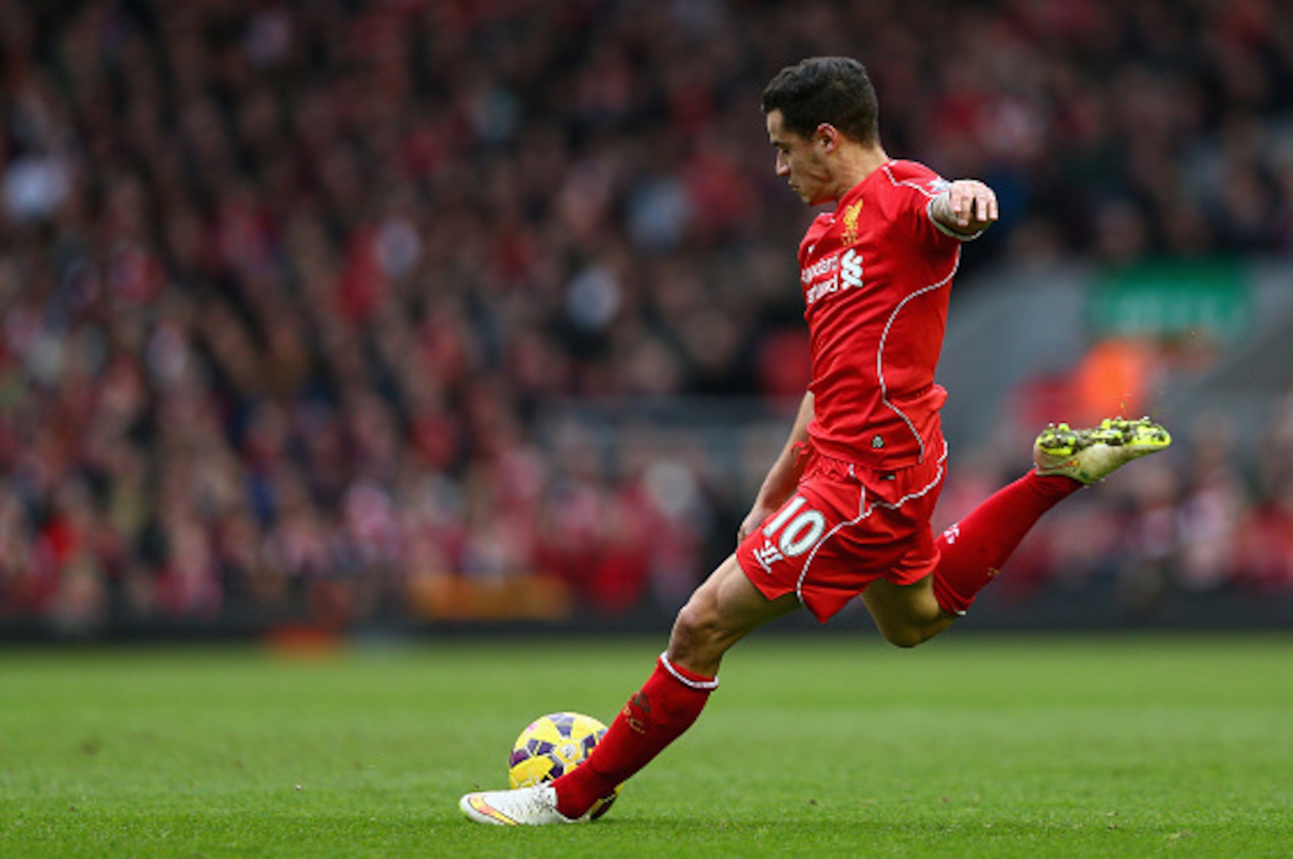LIVERPOOL, ENGLAND - MARCH 01:  Philippe Coutinho of Liverpool takes a shot at goal during the Barclays Premier League match between Liverpool and Manchester City at Anfield on March 1, 2015 in Liverpool, England.  (Photo by Clive Brunskill/Getty Images)