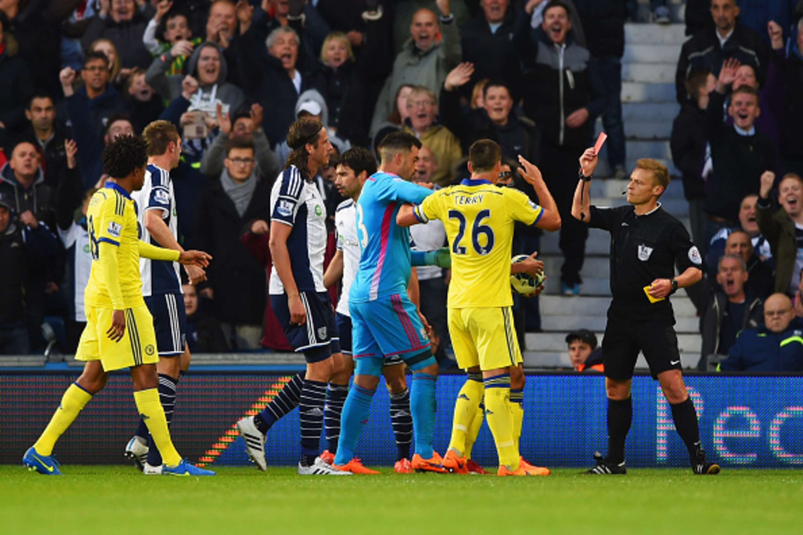 WEST BROMWICH, ENGLAND - MAY 18:  Referee Mike Jones shows a red card to Cesc Fabregas of Chelsea (obscured 2R) as he is sent off during the Barclays Premier League match between West Bromwich Albion and Chelsea at The Hawthorns on May 18, 2015 in West Br