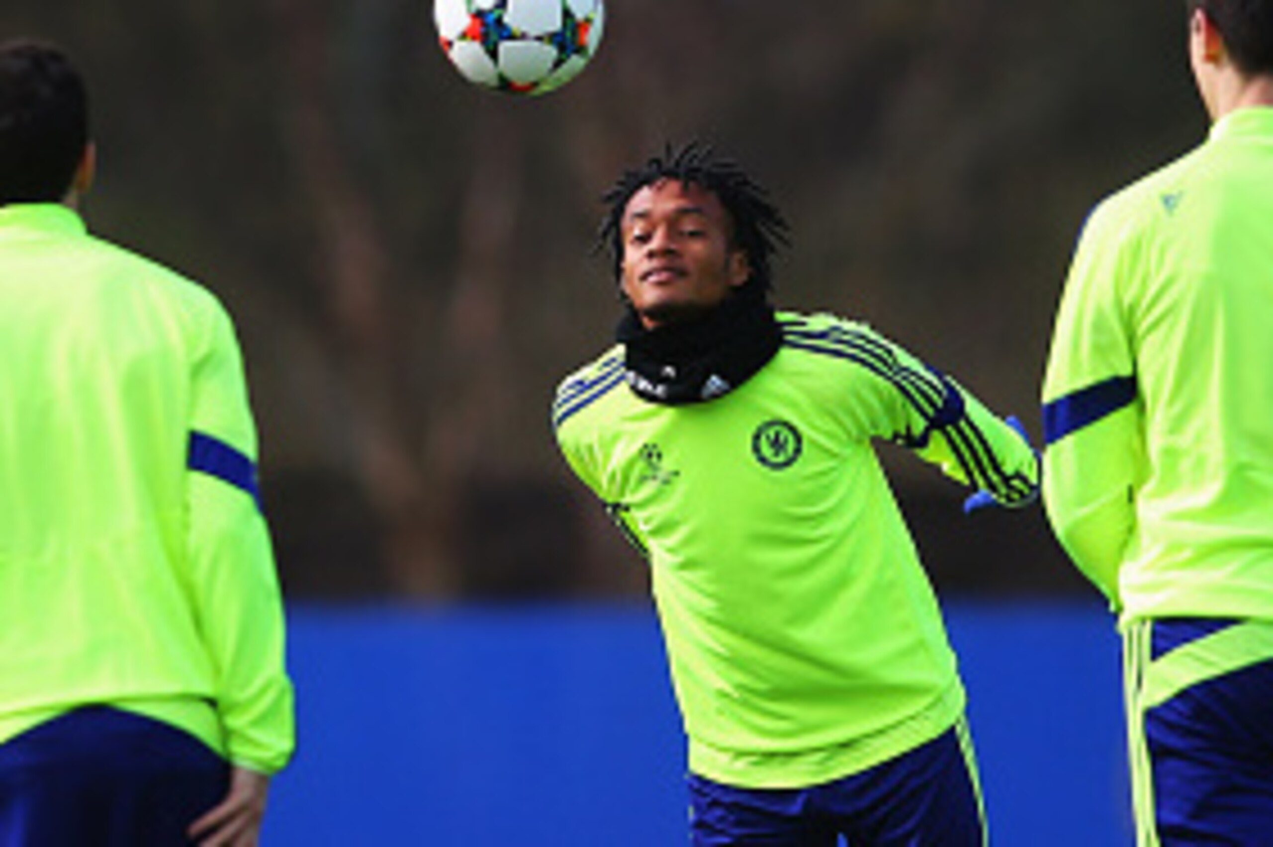 COBHAM, ENGLAND - MARCH 10:  Juan Cuadrado (C) heads the ball alongside team mates during a Chelsea training session ahead of the UEFA Champions League Round of 16 second leg match against Paris Saint-Germain at Chelsea Training Ground on March 10, 2015 i