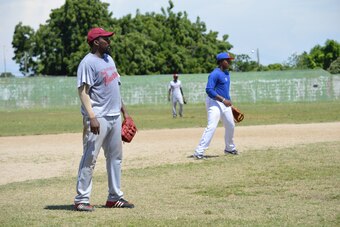 Vlad Sr. and Jr. side by side on the softball diamond