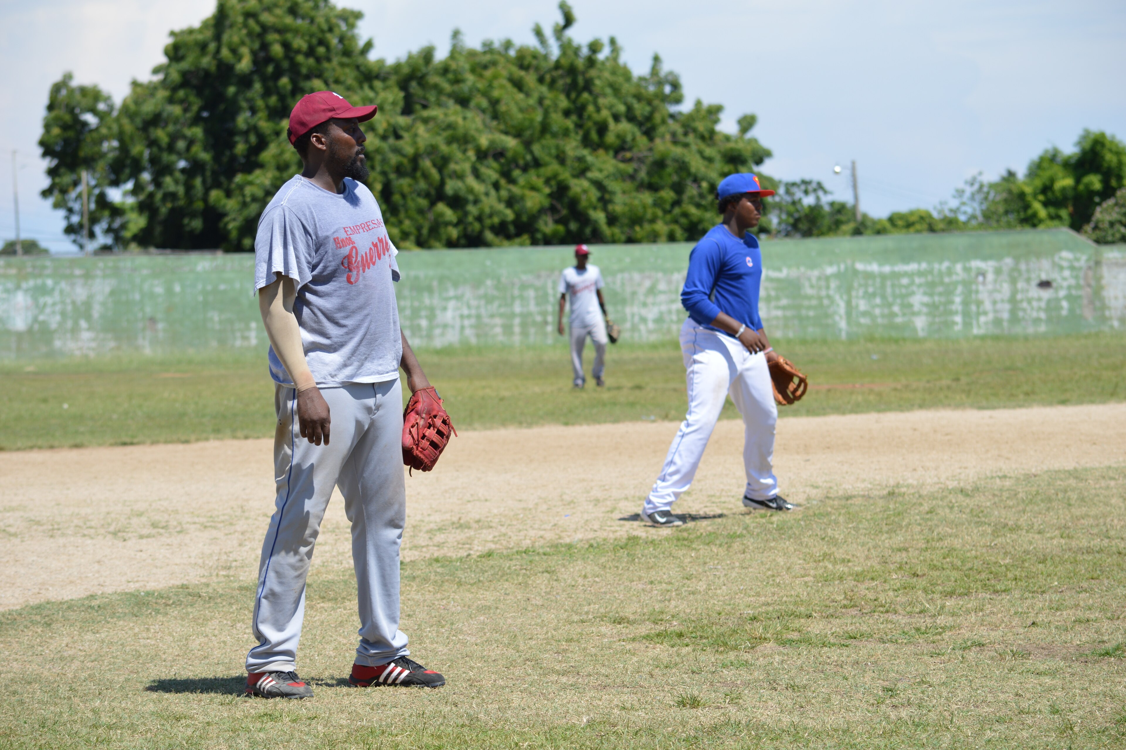 Vlad Sr. and Jr. side by side on the softball diamond