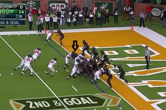 Oklahoma State offensive tackle easily blocks Shawn Oakman.