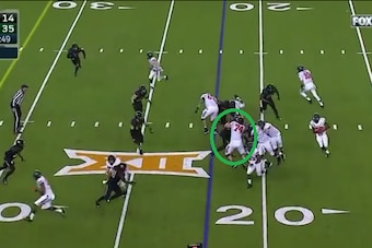 Oklahoma State left tackle successfully hooks Shawn Oakman.