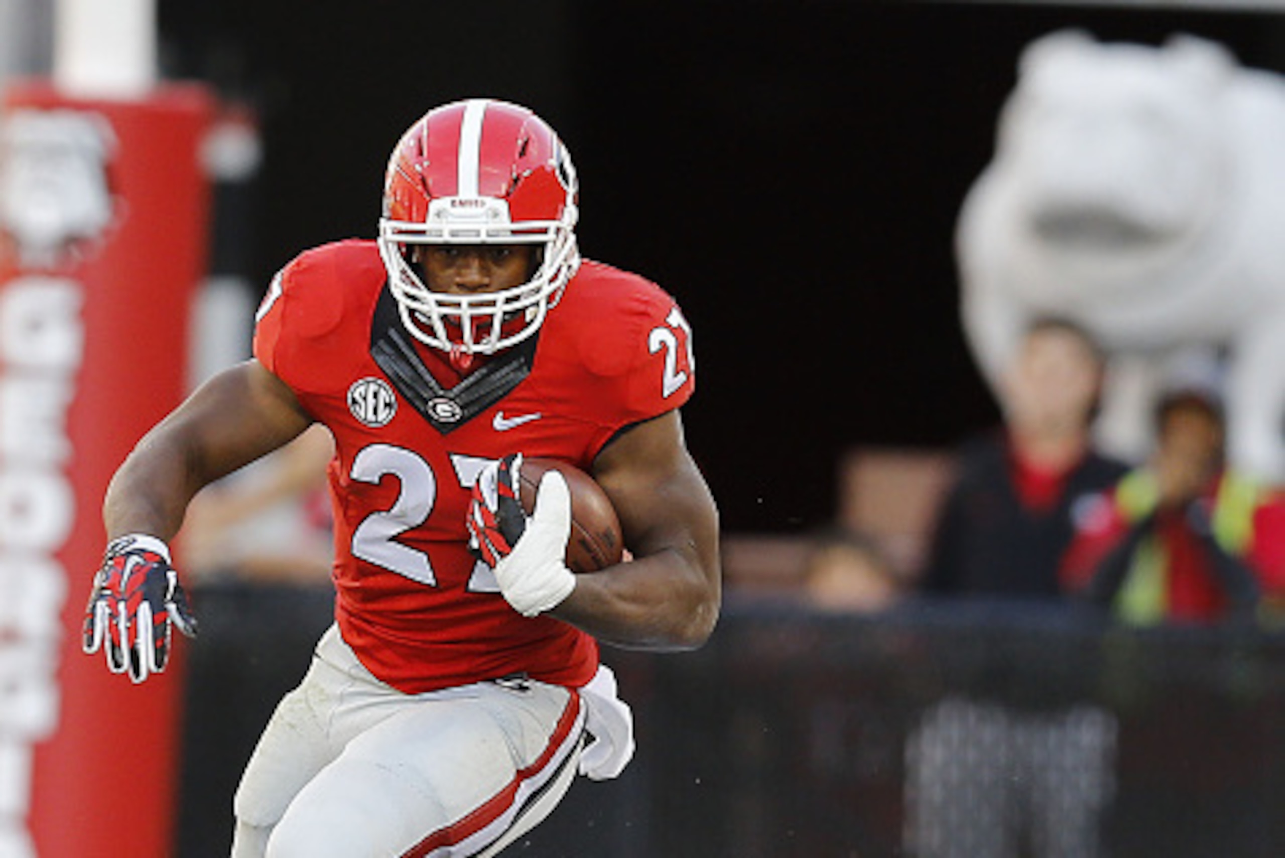 ATHENS, GA - OCTOBER 04: Running back Nick Chubb #27 of the Georgia Bulldogs runs past cornerback Taurean Ferguson #3 of the Vanderbilt Commodores during the game at Sanford Stadium on October 4, 2014 in Athens, Georgia. (Photo by Mike Zarrilli/Getty Im ATHENS, GA - OCTOBER 04: Running back Nick Chubb #27 of the Georgia Bulldogs runs past cornerback Taurean Ferguson #3 of the Vanderbilt Commodores during the game at Sanford Stadium on October 4, 2014 in Athens, Georgia. (Photo by Mike Zarrilli/Getty Im