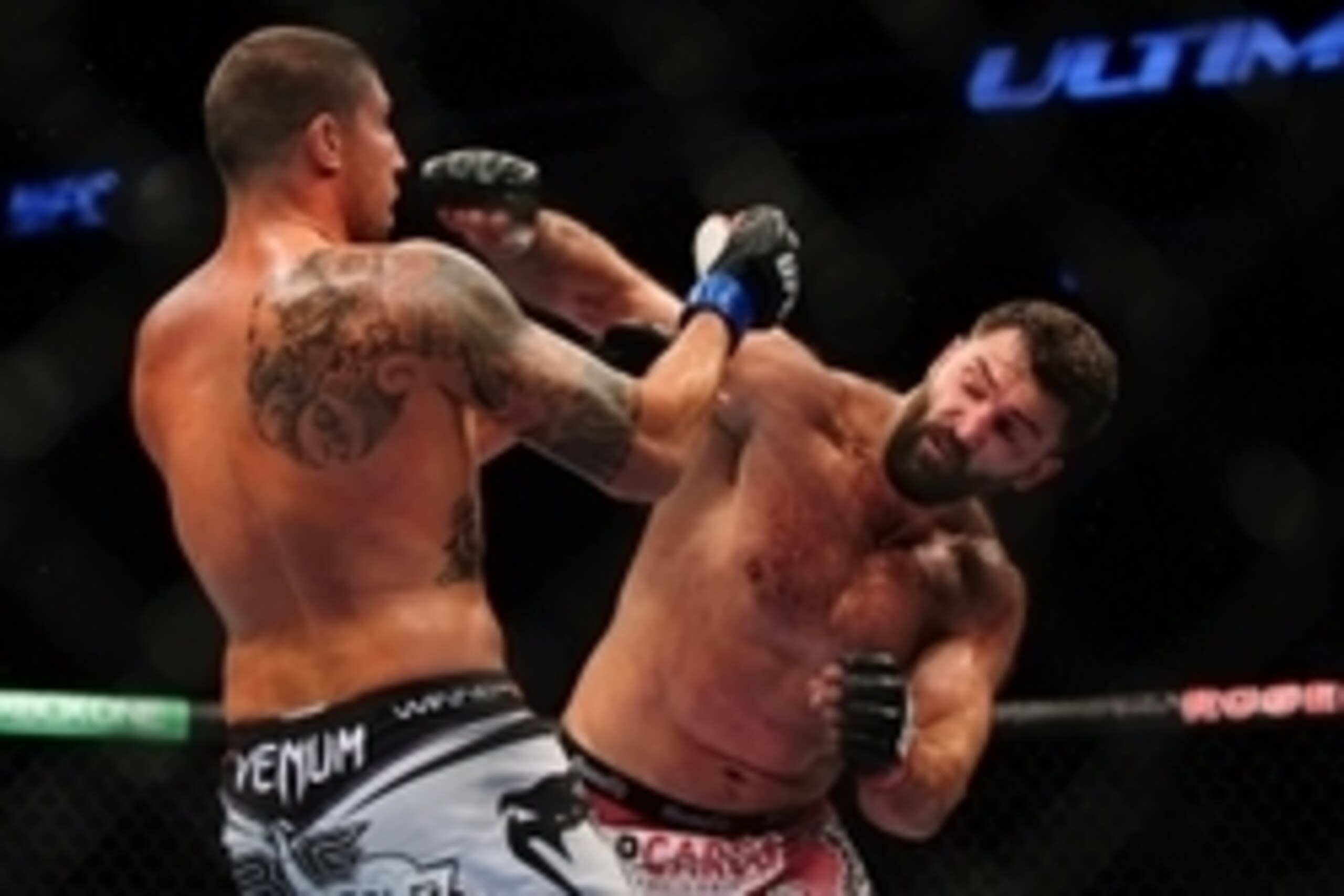 Jun 14, 2014; Vancouver, British Columbia, Canada; Andrei Arlovski (red) fights Brendan Schuab (blue) in the Heavyweight bout at UFC 174 at Rogers Arena. Andrei Arlovski defeats Brendan Schuab via split decision. Mandatory Credit: Anne-Marie Sorvin-USA TO
