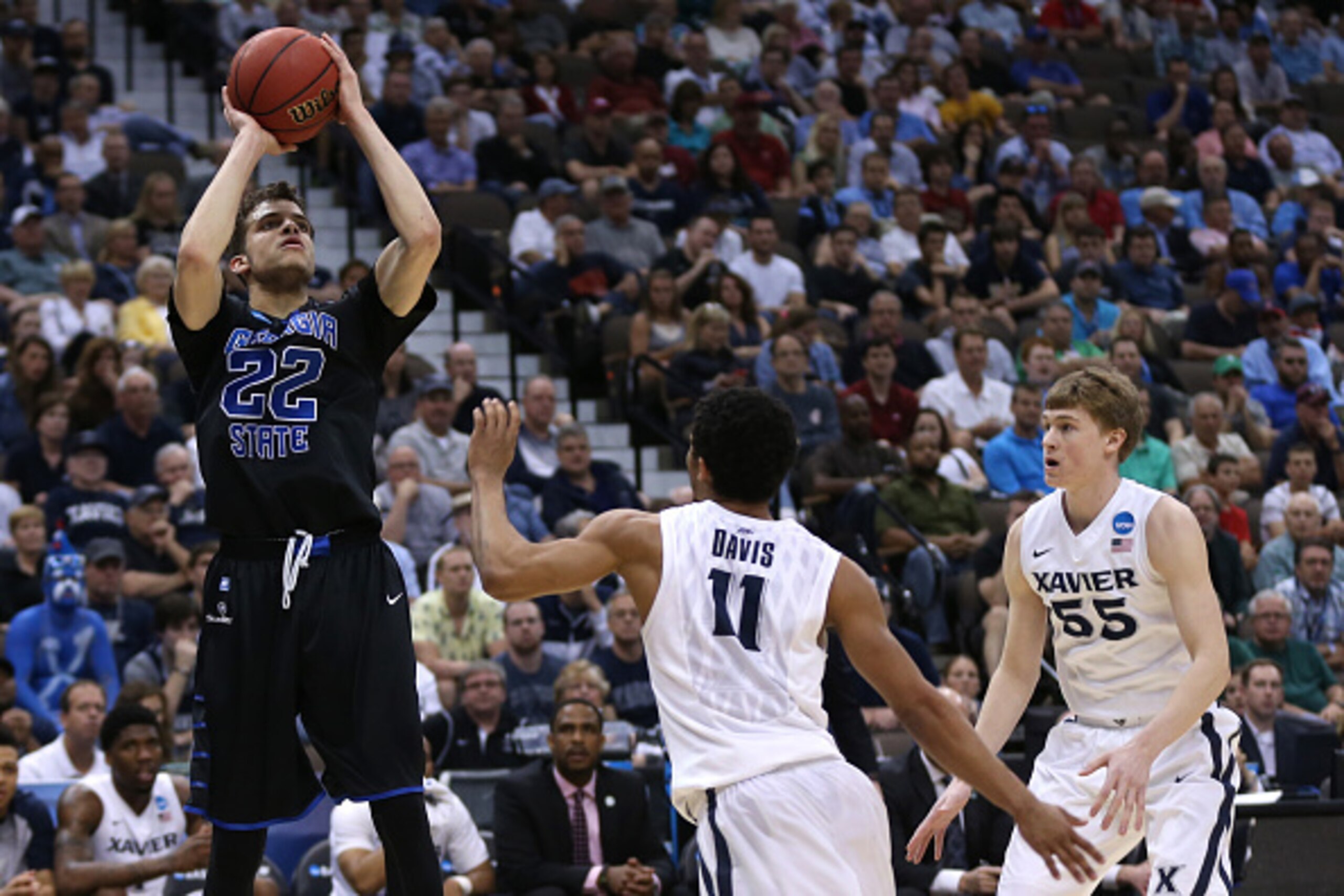 JACKSONVILLE, FL - MARCH 21: R.J. Hunter #22 of the Georgia State Panthers puts up a shot over Dee Davis #11 of the Xavier Musketeers in the first half during the third round of the 2015 NCAA Men's Basketball Tournament at Jacksonville Veterans Memorial A