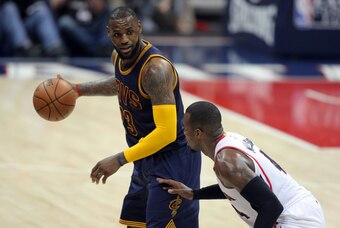 May 20, 2015; Atlanta, GA, USA; Cleveland Cavaliers forward LeBron James (23) controls the ball against Atlanta Hawks forward Paul Millsap (4) during the fourth quarter of game one of the Eastern Conference Finals of the NBA Playoffs at Philips Arena. Cle