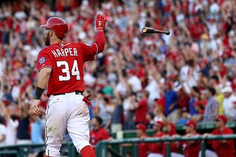 WASHINGTON, DC - MAY 09: Bryce Harper #34 of the Washington Nationals tosses his bat after hitting a walk off home run in the ninth inning against the Atlanta Braves at Nationals Park on May 9, 2015 in Washington, DC. The Washington Nationals won, 8-6. (P