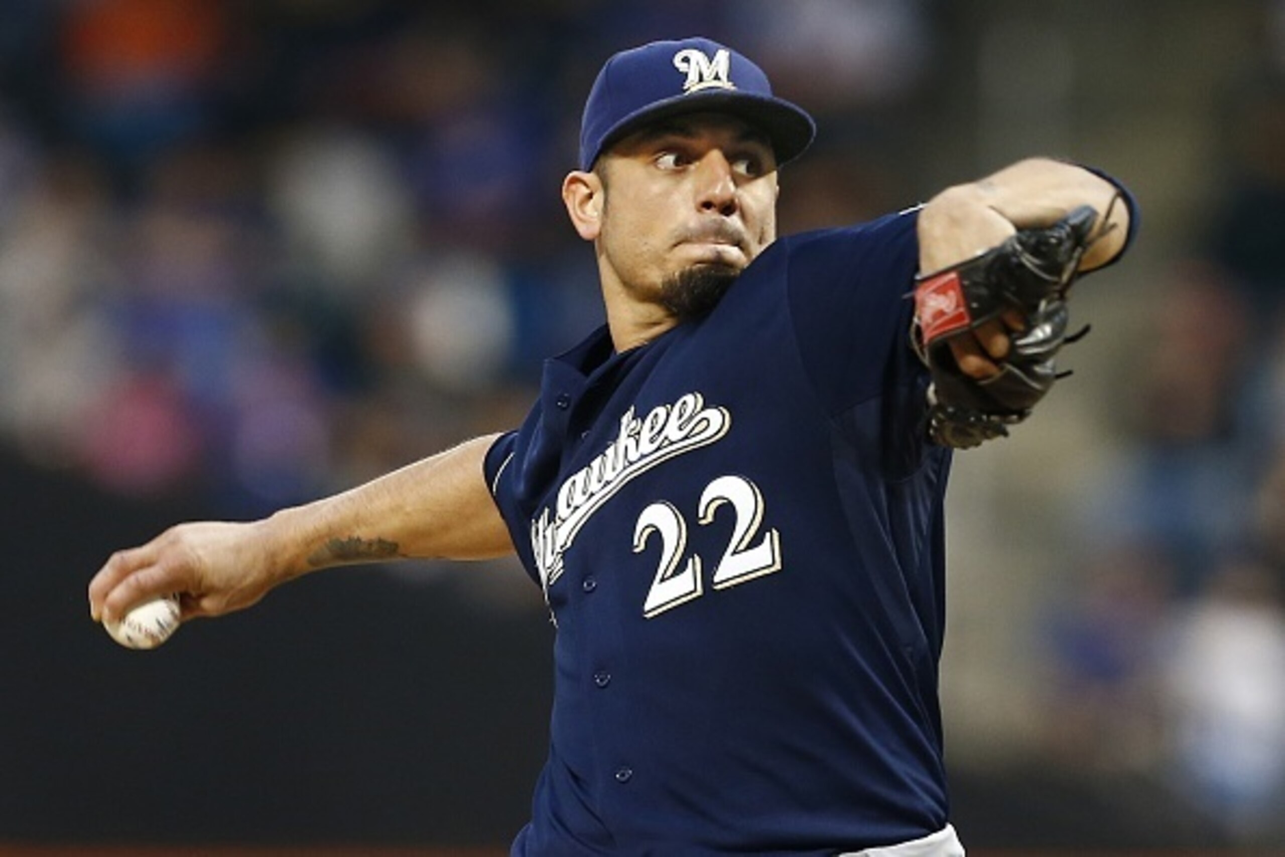 NEW YORK, NY - MAY 16:  Pitcher Matt Garza #22 of the Milwaukee Brewers delivers a pitch against the New York Mets during the first inning on May 16, 2015 at Citi Field in the Flushing neighborhood of the Queens borough of New York City. (Photo by Rich Sc