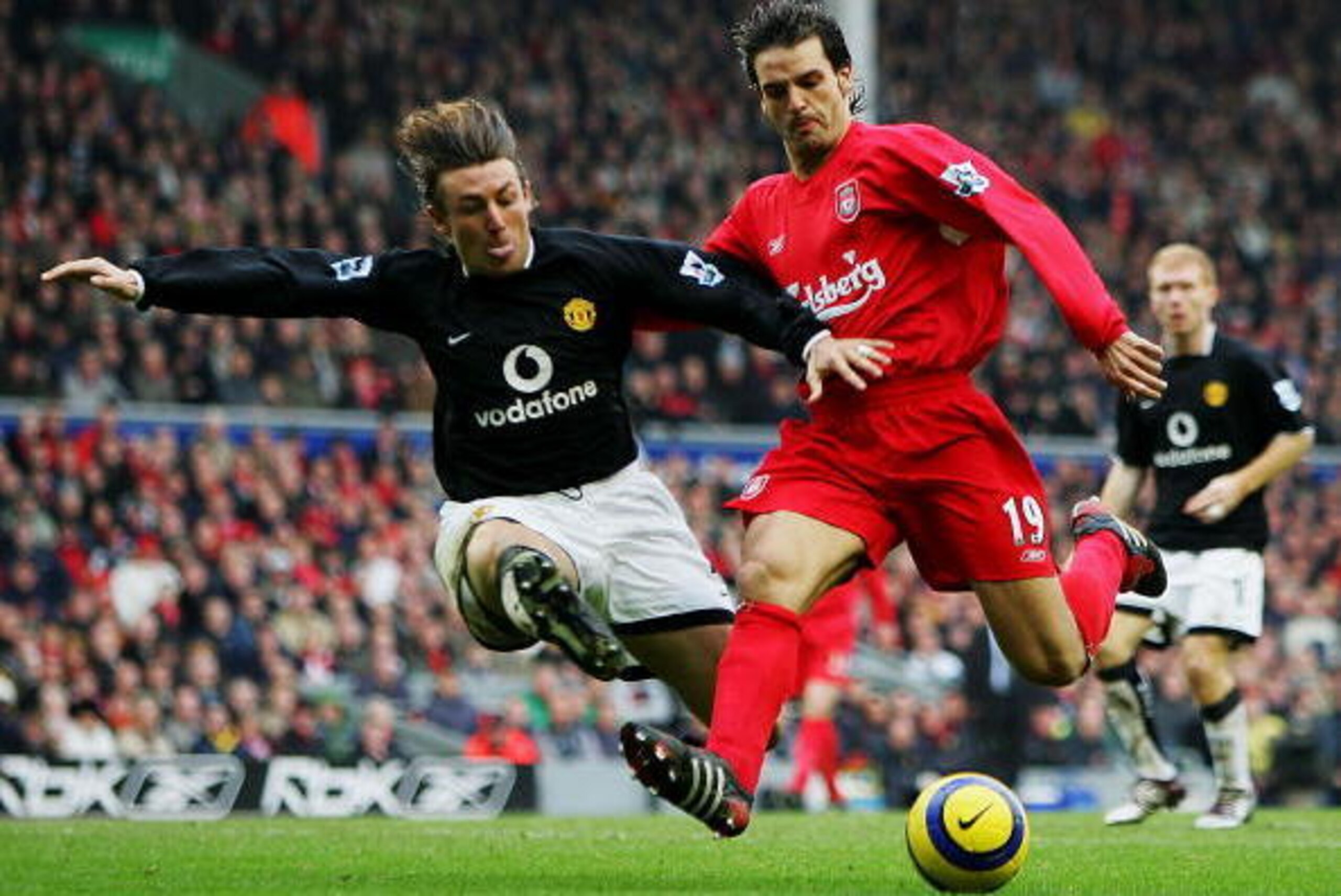 LIVERPOOL, ENGLAND - JANUARY 15:  Gabriel Heinze of of Manchester United tackles Fernando Morientes of Liverpool during the Barclays Premiership match between Liverpool and Manchester United at Anfield on January 15, 2005 in Liverpool, England.  (Photo by