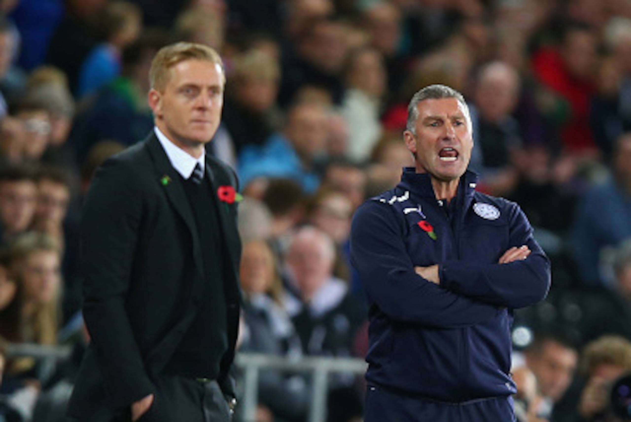 SWANSEA, WALES - OCTOBER 25:  Manager Garry Monk of Swansea City and Nigel Pearson, manager of Leicester City on the touchline during the Barclays Premier League match between Swansea City and Leicester City at Liberty Stadium on October 25, 2014 in Swans