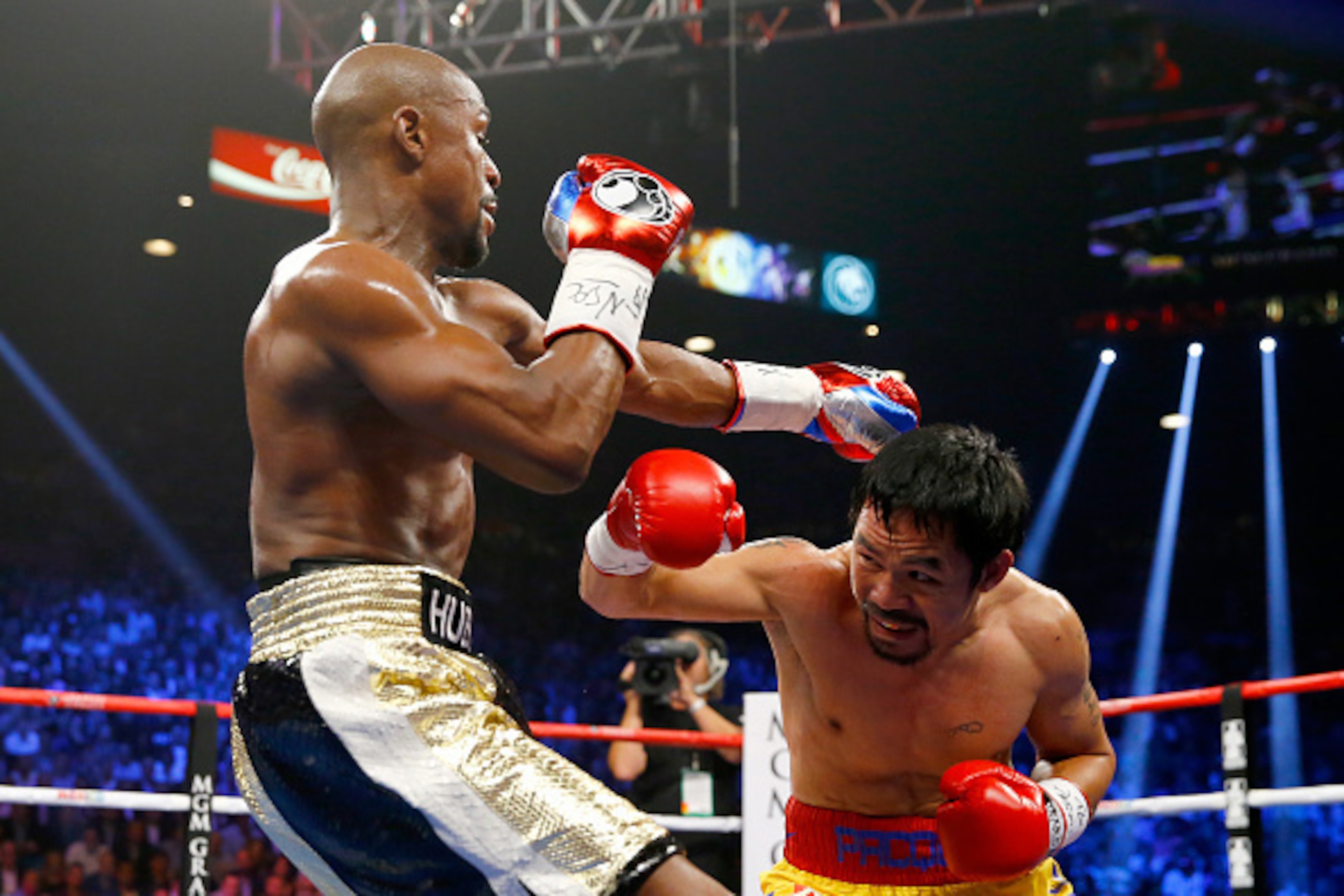 LAS VEGAS, NV - MAY 02:  Manny Pacquiao throws a right at Floyd Mayweather Jr. during their welterweight unification championship bout on May 2, 2015 at MGM Grand Garden Arena in Las Vegas, Nevada.  (Photo by Al Bello/Getty Images)