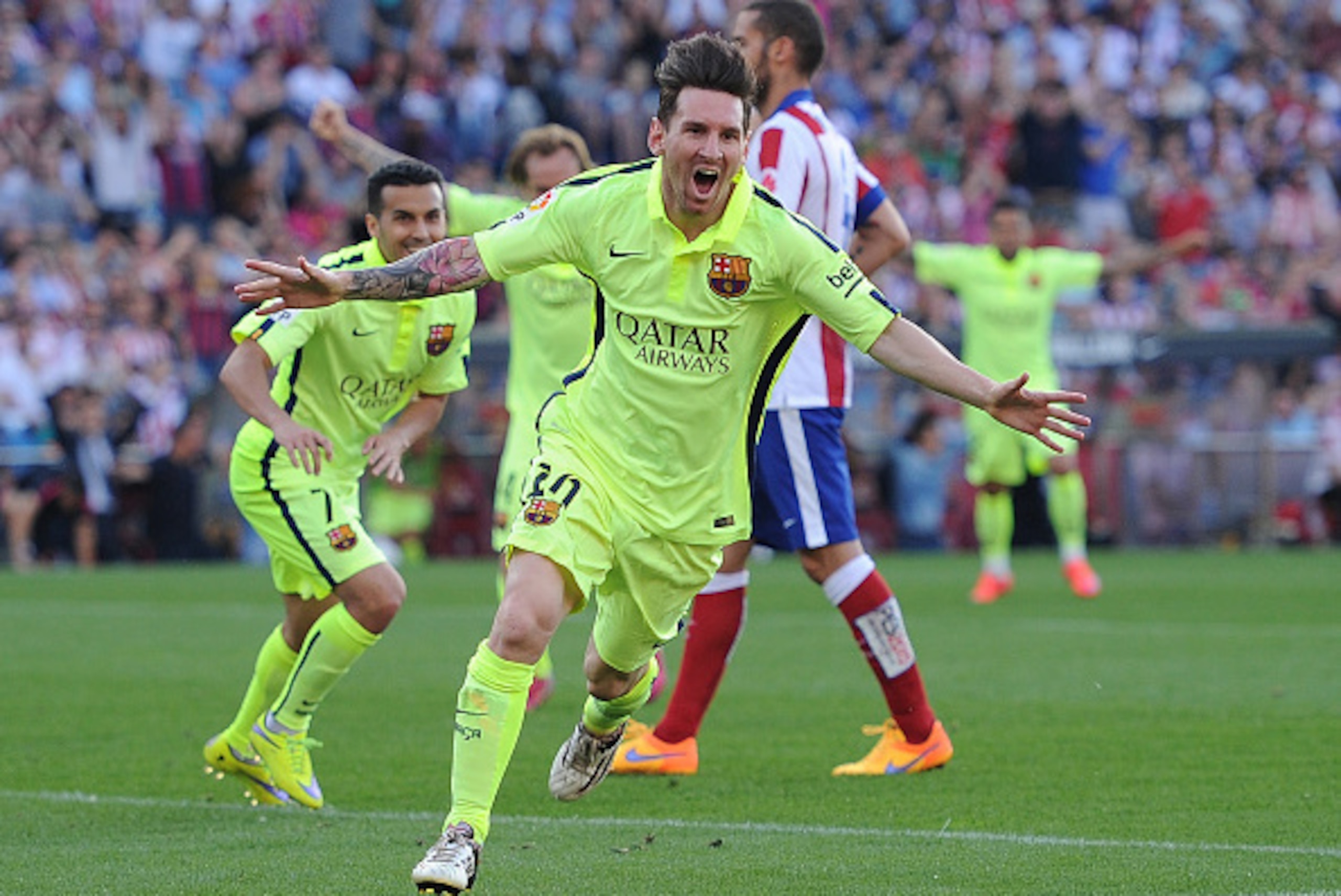MADRID, SPAIN - MAY 17:  Lionel Messi of FC Barcelona celebrates after scoring his team's opening goal during the La Liga match between Club Atletico de Madrid and FC Barcelona at Vicente Calderon Stadium on May 17, 2015 in Madrid, Spain.  (Photo by Denis
