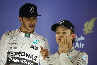 BAHRAIN, BAHRAIN - APRIL 19:  Race winner Lewis Hamilton of Great Britain and Mercedes GP celebrates with teammate third placed Nico Rosberg of Germany and Mercedes GP during the Bahrain Formula One Grand Prix at Bahrain International Circuit on April 19,
