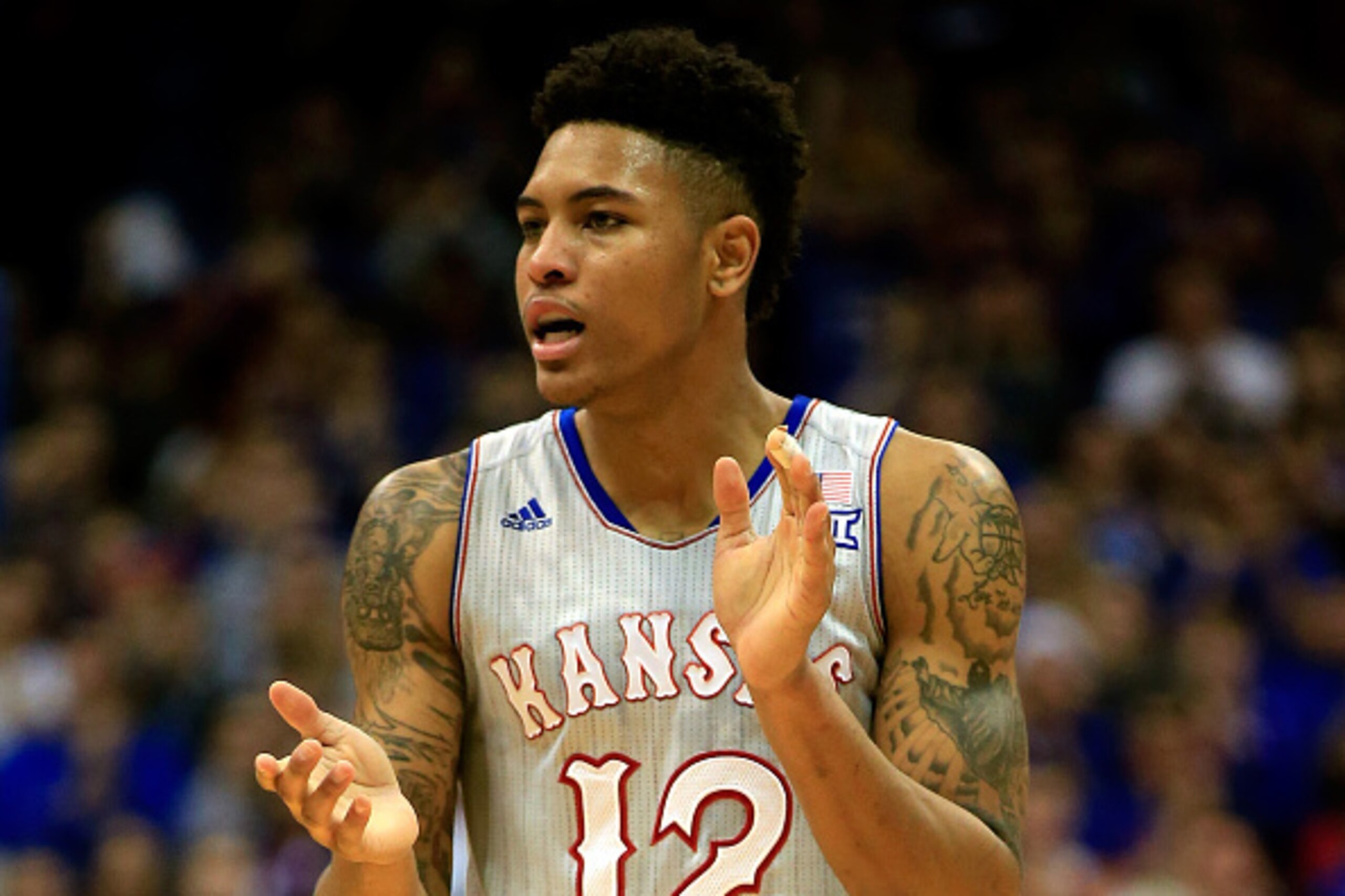 LAWRENCE, KS - DECEMBER 30:  Kelly Oubre Jr. #12 of the Kansas Jayhawks claps after scoring during the game against the Kent State Golden Flashes at Allen Fieldhouse on December 30, 2014 in Lawrence, Kansas.  (Photo by Jamie Squire/Getty Images)