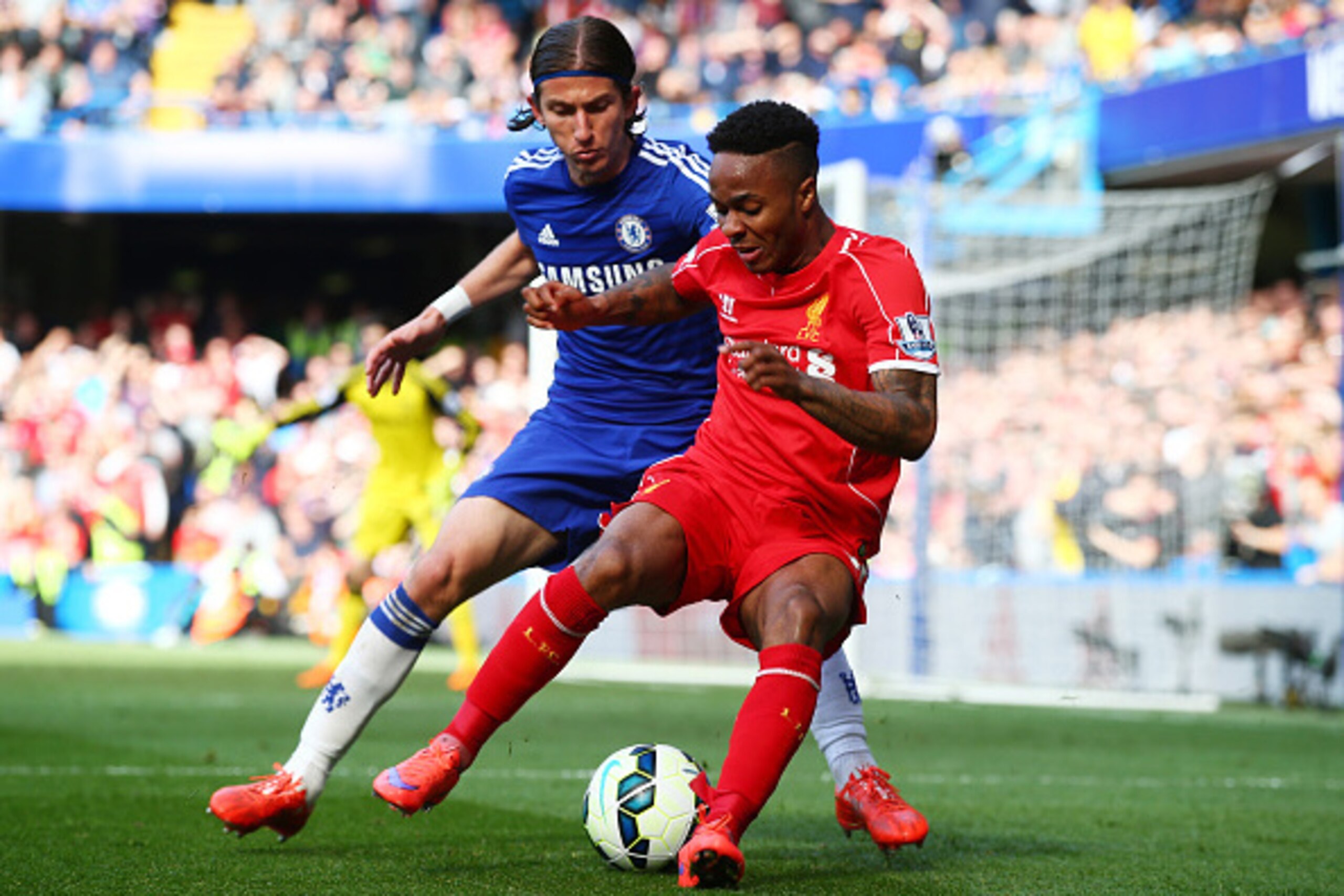 LONDON, ENGLAND - MAY 10: Raheem Sterling of Liverpool is challenged by Filipe Luis of Chelsea during the Barclays Premier League match between Chelsea and Liverpool at Stamford Bridge on May 10, 2015 in London, England. (Photo by Clive Rose/Getty Image LONDON, ENGLAND - MAY 10: Raheem Sterling of Liverpool is challenged by Filipe Luis of Chelsea during the Barclays Premier League match between Chelsea and Liverpool at Stamford Bridge on May 10, 2015 in London, England. (Photo by Clive Rose/Getty Image