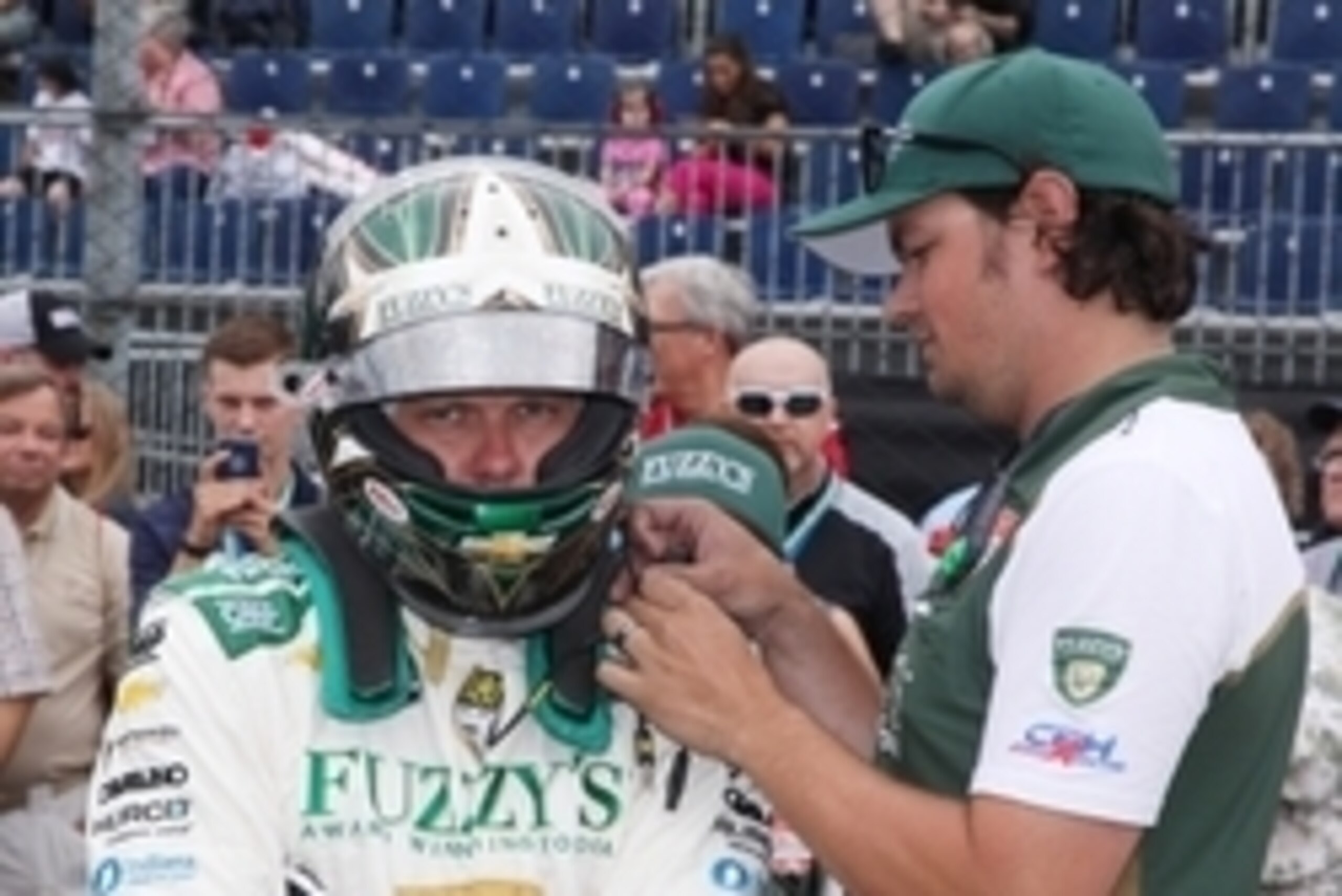 May 16, 2015; Indianapolis, IN, USA; Verizon IndyCar Series driver Ed Carpenter gets help putting on his helmet from a crew member during qualifications for the 2015 Indianapolis 500 at Indianapolis Motor Speedway. Mandatory Credit: Brian Spurlock-USA TOD May 16, 2015; Indianapolis, IN, USA; Verizon IndyCar Series driver Ed Carpenter gets help putting on his helmet from a crew member during qualifications for the 2015 Indianapolis 500 at Indianapolis Motor Speedway. Mandatory Credit: Brian Spurlock-USA TOD