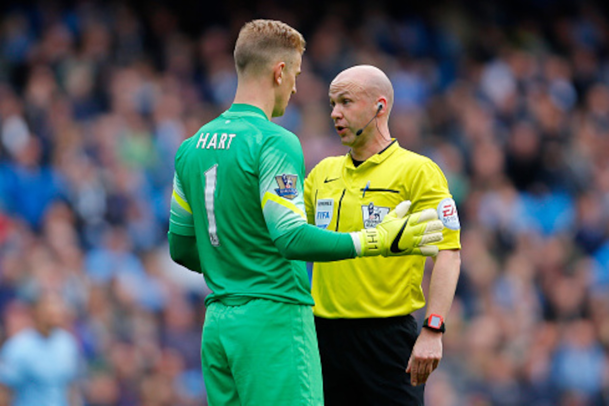 ##MANCHESTER, ENGLAND - APRIL 19: Joe Hart of Manchester City speaks to Referee  Anthony Taylor during the Barclays Premier League match between Manchester City and West Ham United at Etihad Stadium on April 19, 2015 in Manchester, England.  (Photo by Pau
