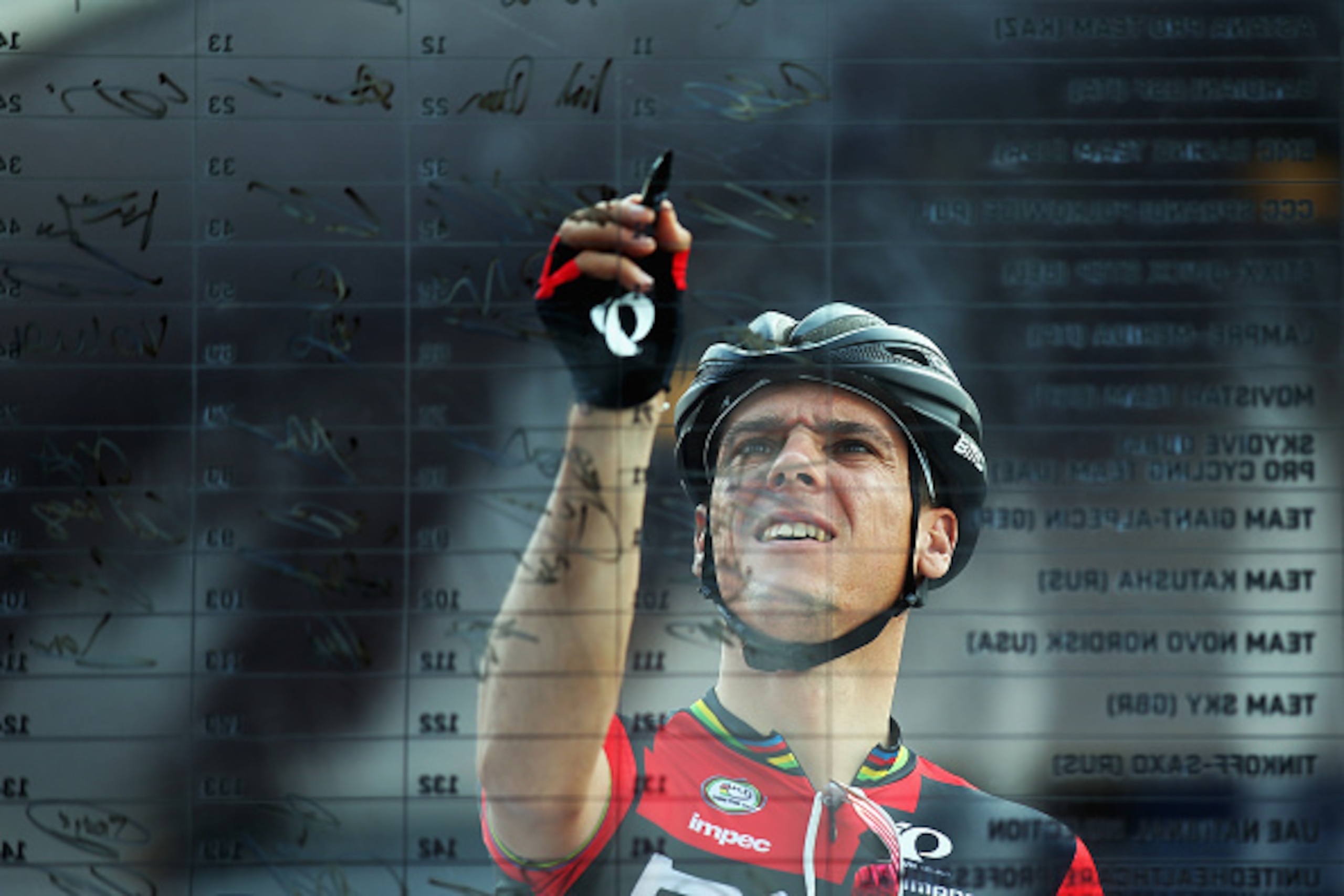 DUBAI, UNITED ARAB EMIRATES - FEBRUARY 06: Philippe Gilbert of Belgium and the BMC Racing team signs on at the start of stage three of the Dubai Tour from the Dubai International Marine Club to Hatta Dam on February 6, 2015 in Dubai, United Arab Emirates.