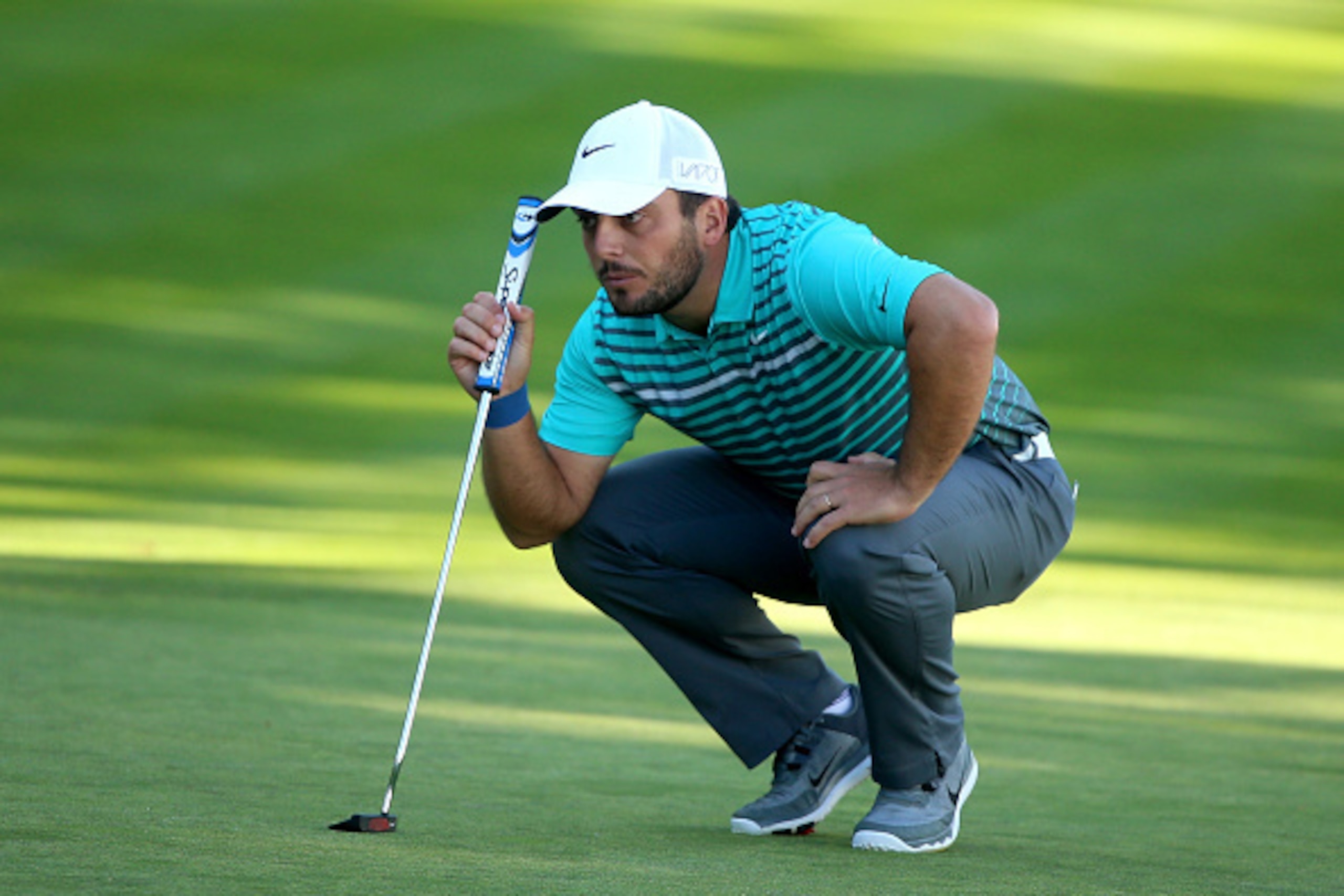 VIRGINIA WATER, ENGLAND - MAY 21:  Francesco Molinari of Italy lines up on the 18th green  during day 1 of the BMW PGA Championship at Wentworth on May 21, 2015 in Virginia Water, England.  (Photo by Andrew Redington/Getty Images)