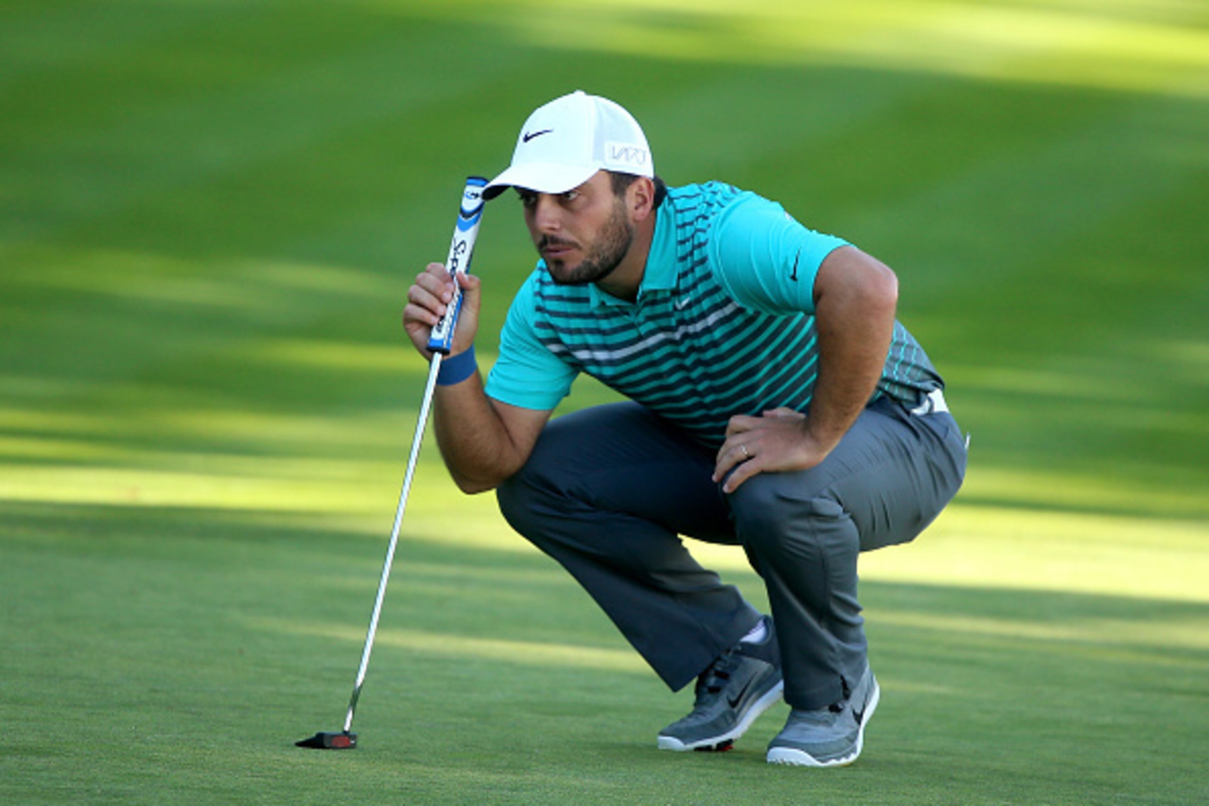 VIRGINIA WATER, ENGLAND - MAY 21:  Francesco Molinari of Italy lines up on the 18th green  during day 1 of the BMW PGA Championship at Wentworth on May 21, 2015 in Virginia Water, England.  (Photo by Andrew Redington/Getty Images)