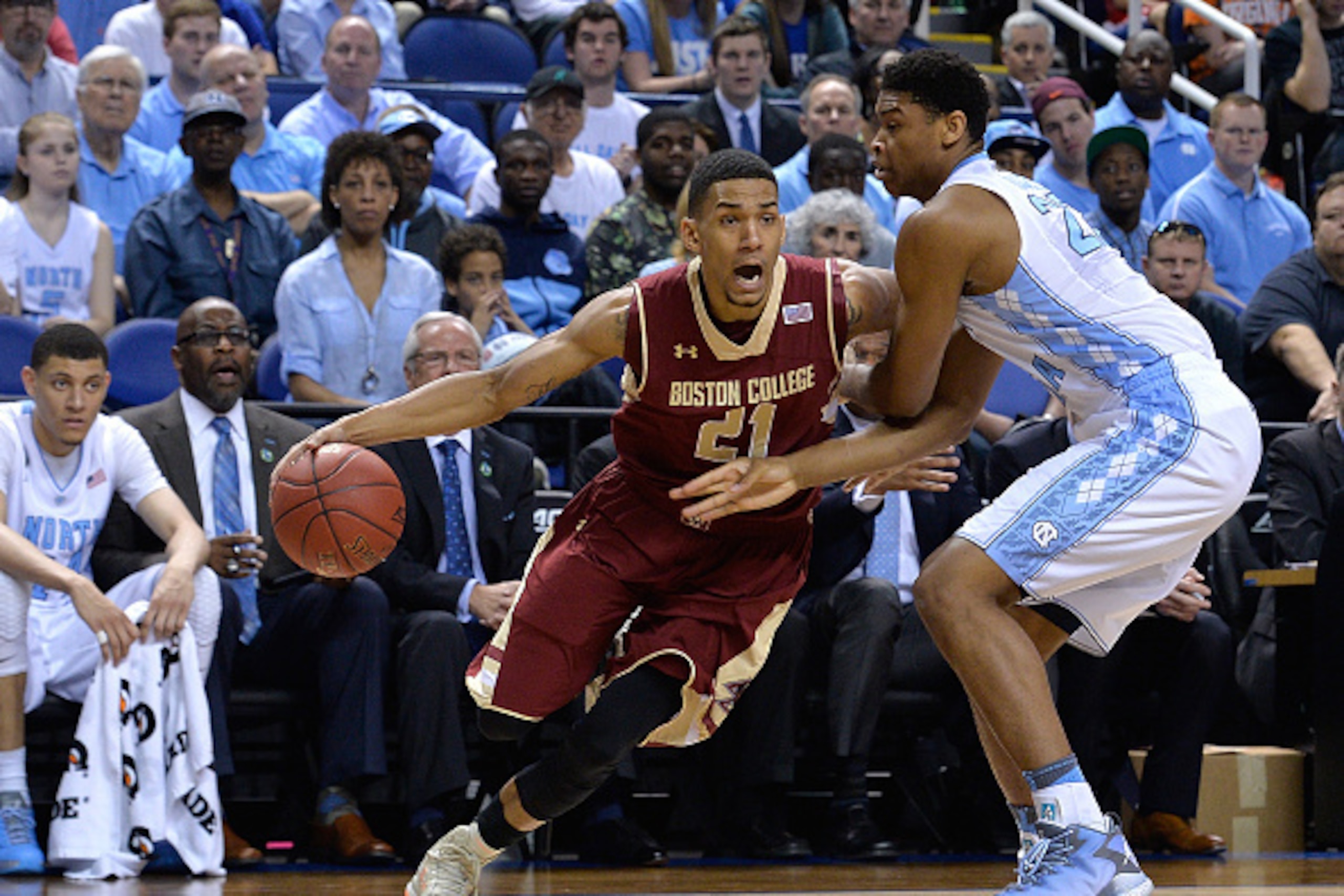 GREENSBORO, NC - MARCH 11:  Isaiah Hicks #22 of the North Carolina Tar Heels defends Olivier Hanlan #21 of the Boston College Eagles during a second round game of the ACC basketball tournament at Greensboro Coliseum on March 11, 2015 in Greensboro, North 