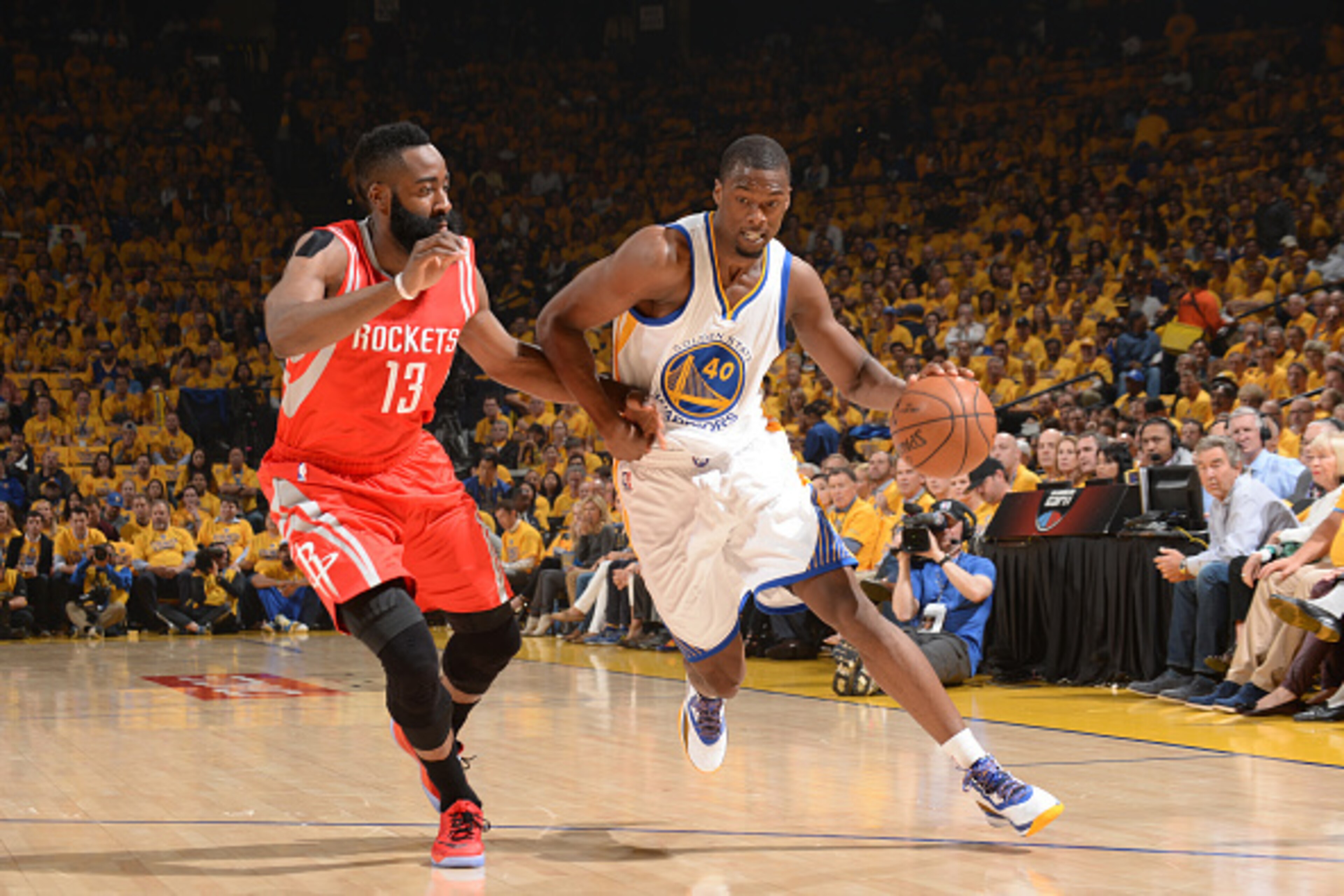 OAKLAND, CA - MAY 19: Harrison Barnes #40 of the Golden State Warriors drives to the basket against James Harden #13 of the Houston Rockets during Game One of the Western Conference Finals during the NBA Playoffs on May 19, 2015 at ORACLE Arena in Oakland